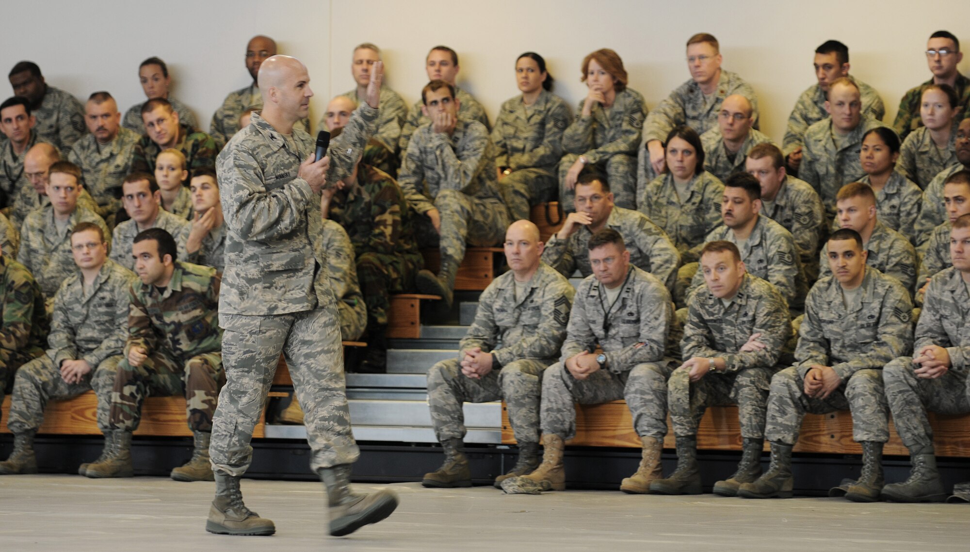 RAF MILDENHALL, England -- Col. Chad Manske, 100th Air Refueling Wing commander, gets his Airmen fired up at a pre-Operational Readiness Inspection pep rally at the Hardstand Fitness Center here Oct. 2. The rally gave the colonel a chance to let his Airmen know he's behind them during the two-week test of their readiness. (U.S. Air Force photo/Senior Airman Thomas Trower) 