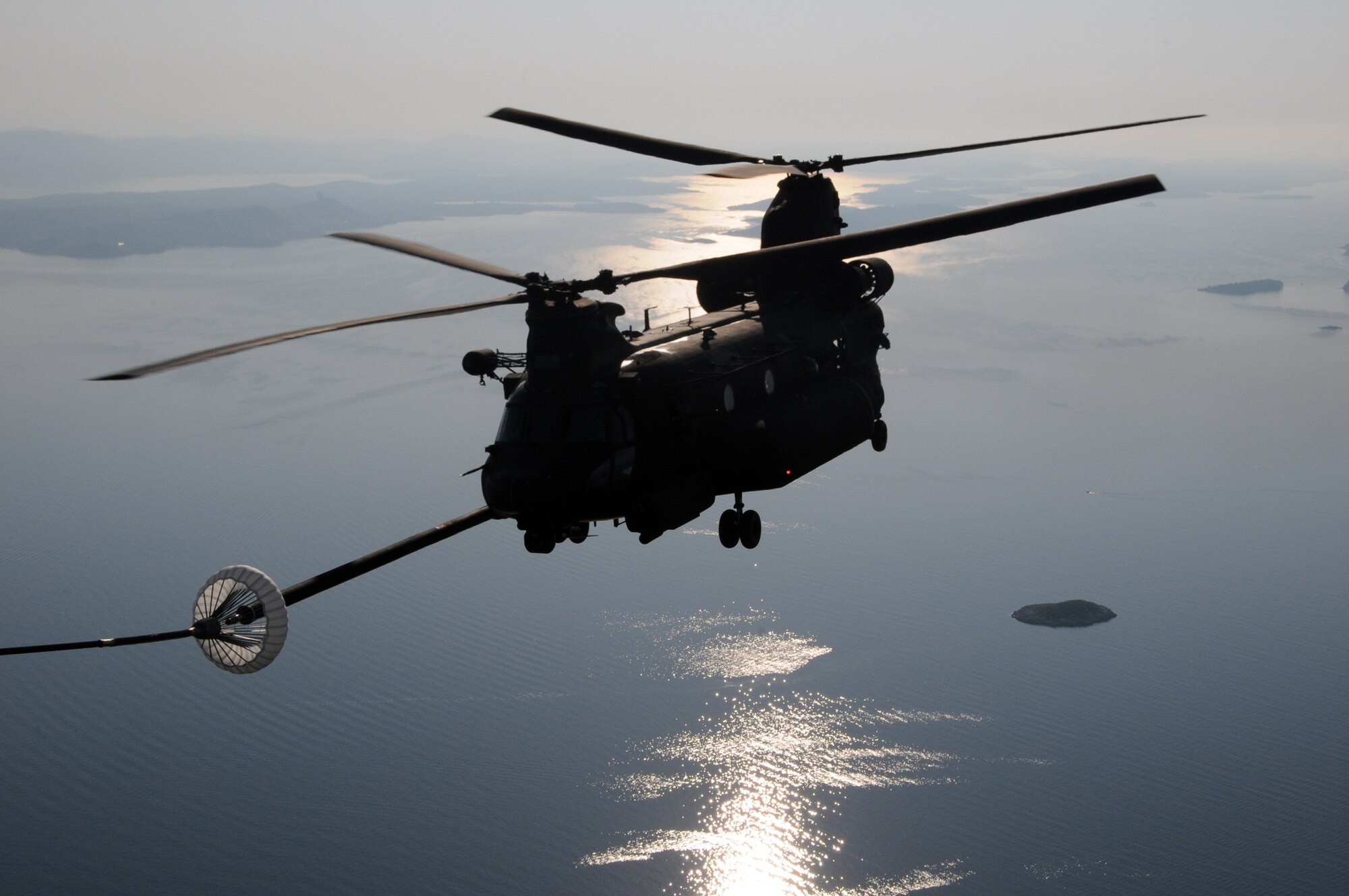 ZADAR, Croatia — A U.S Army MH-47 Chinook assigned to to the 160th Special Operations Aviation Regiment (Airborne), Fort Campbell, Ky., is refueled by a MC-130P Shadow airplane assigned to the 67th Special Operations Squadron, 352nd Special Operations Group based at RAF Mildenhall, England, as part of a helicopter aerial refueling mission over the Adriatic Sea as part of the Jackal Stone 2009 exercise being held here. (Special Operations Europe photo by Army Master Sgt. Donald Sparks)