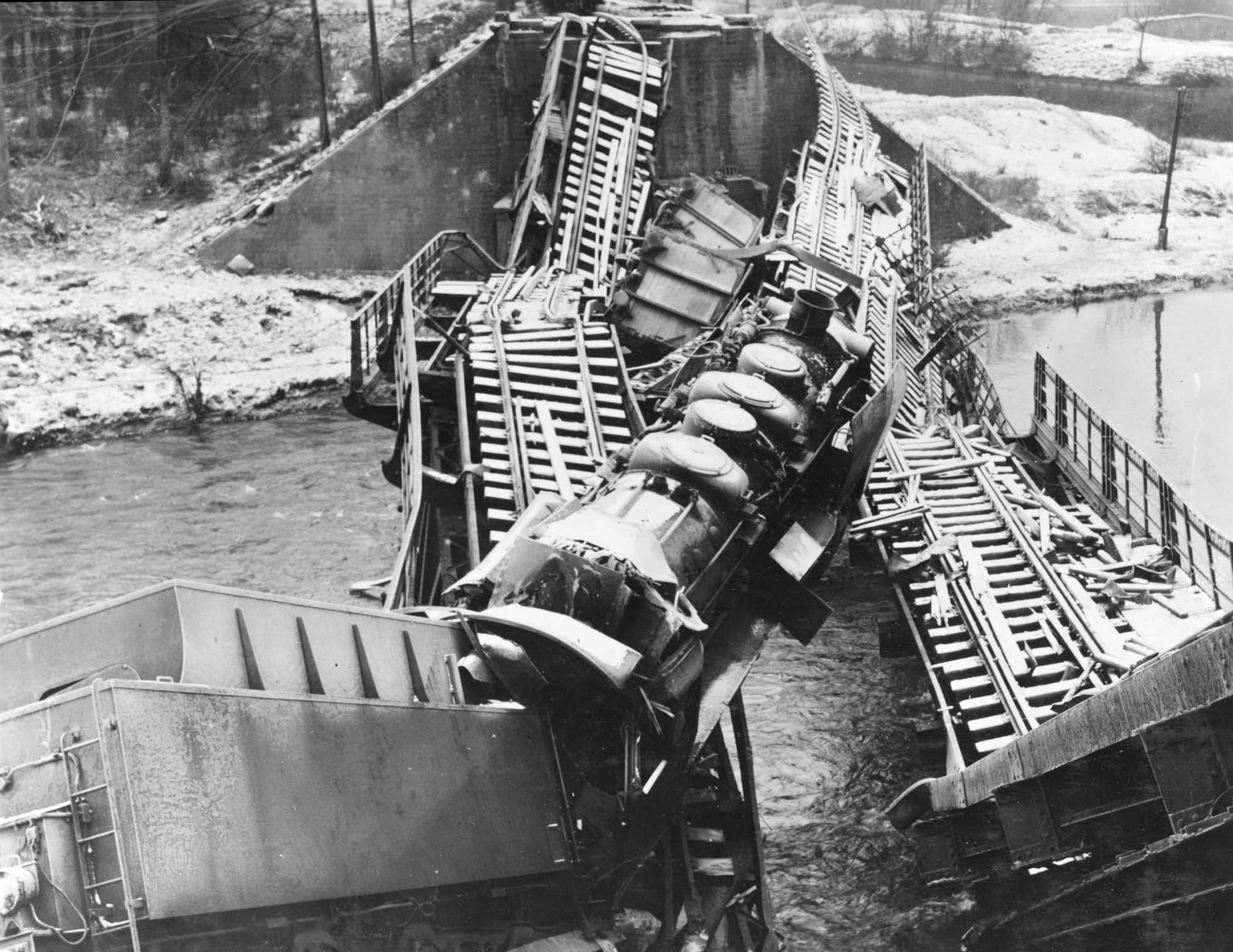 9th Air Force fighter-bombers caught this train trying to cross the Moselle River and destroyed both it and the bridge it was on. (U.S. Air Force photo)