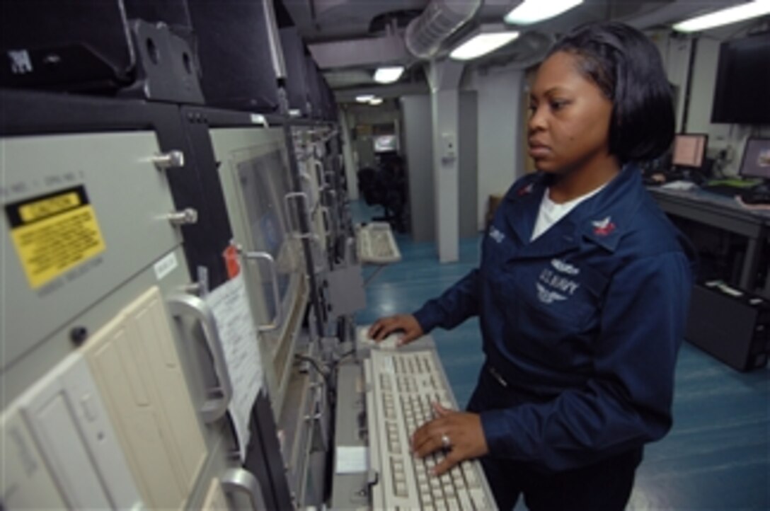 U.S. Navy Petty Officer 1st Class Lashandrea Young reviews the database logs of the Naval Tactical Command Support System network of computer systems aboard the aircraft carrier USS Harry S. Truman (CVN 75) in the Atlantic Ocean on Sept. 19, 2009.  The Naval Tactical Command Support System controls logistical information throughout the ship during routine updates.  The Truman is underway participating in Joint Task Force Exercise, a scenario-driven tactical exercise.  