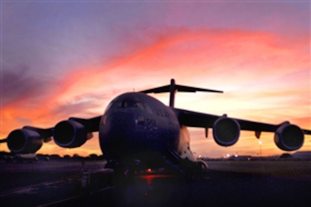 A C-17 Globemaster III sits on Hickam Air Force Base, Hawaii, Sept. 30, 2009, as crews prepare to deliver humanitarian supplies to the Samoa region, which was devastated by a tsunami. A contingent from Hawaii, including Hawaii National Guard and Hawaii Air National Guard, took off for American Samoa with relief supplies and equipment to assist in the region.