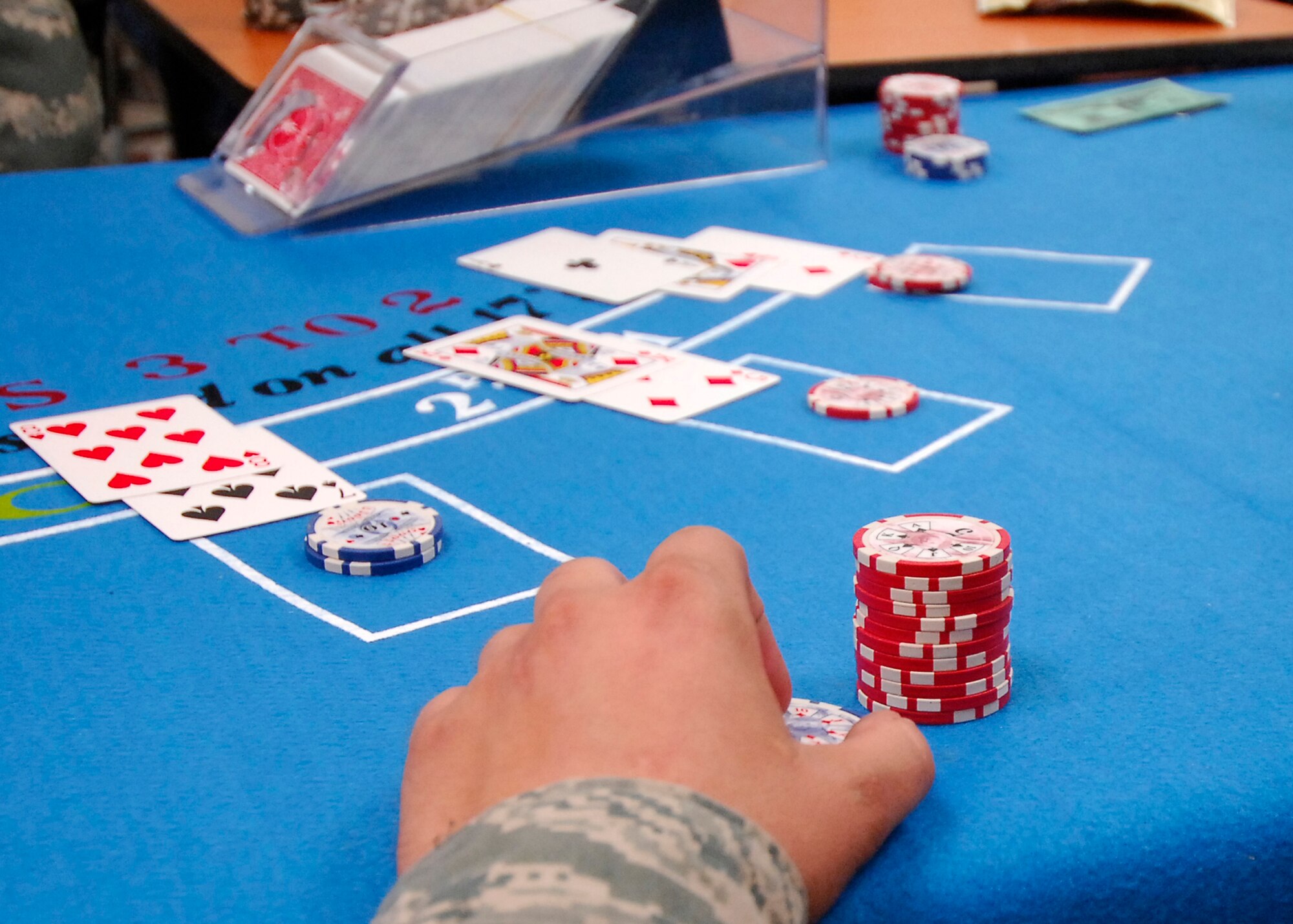 BAGRAM AIRFIELD, Afghanistan -- The 455th Air Expeditionary Wing 5/6 club held the first ever Casino Night, which was a way to bring U.S. and Coalition Forces together for a morale boosting event.  The attendees were given play money to play games such as black jack, poker, craps and roulette.  The Staff and Technical Sergeants make up the 5/6 club who provide great ways to spread morale.  Casino Night was held at the services Pre-Engineered Building, which is where a number of morale functions take place.  (U.S. Air Force photo/Senior Airman Felicia Juenke)