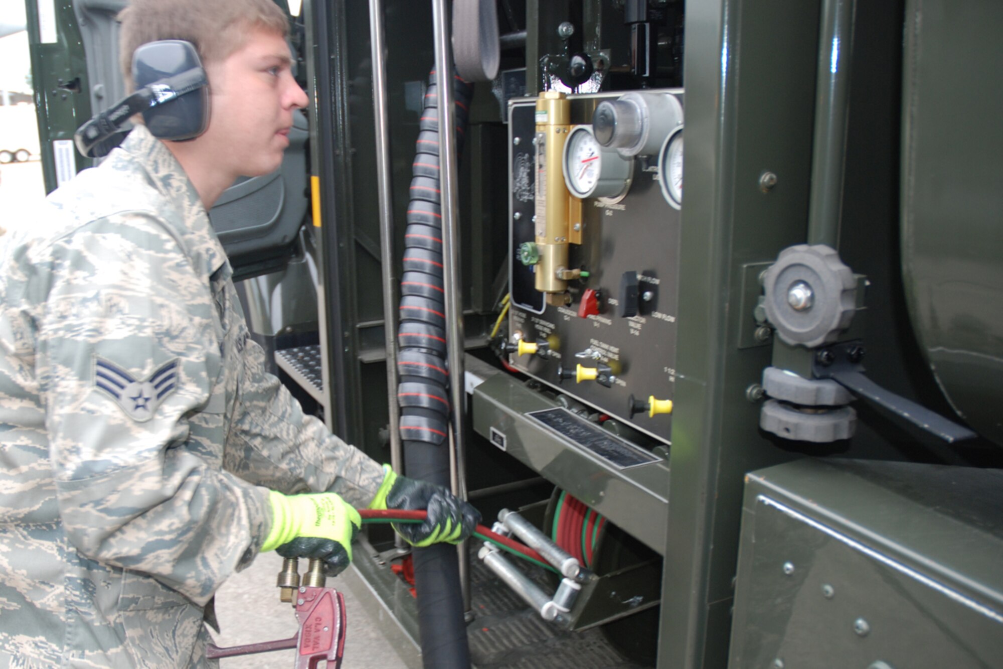 Staff Sgt. Nathaniel M. Mather from the 94th Logistics Readiness Squadron refuels a C-17 aircraft from the 315th Airlift Wing, Charleston Air Force Base, S.C. in preparation to transport FEMA communication equipment and supplies to Hickam AFB, HI from Dobbins Air Reserve Base, Ga. Oct. 2. FEMA will set up a command station in Hawaii to communicate with aircraft delivering humanitarian supplies to the tsunami-devastated Samoa region in the South Pacific. (U.S. Force photo/Tech. Sgt. James Branch)