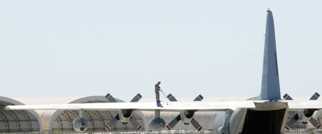A Marine washes the wing of a KC-130 Hercules with Marine Aerial Refueler Transport Squadron 234 from Fort Worth, Texas, on the flight line at the Marine Corps Air Station in Yuma, Ariz., Oct. 3, 2009. Marines with VMGR-234 are in Yuma participating in the Weapons and Tactics Instructor course, which started in September and ends in early November. VMGR-234 provides aerial refueling service for Marine Corps aircraft and transports personnel, equipment and supplies.