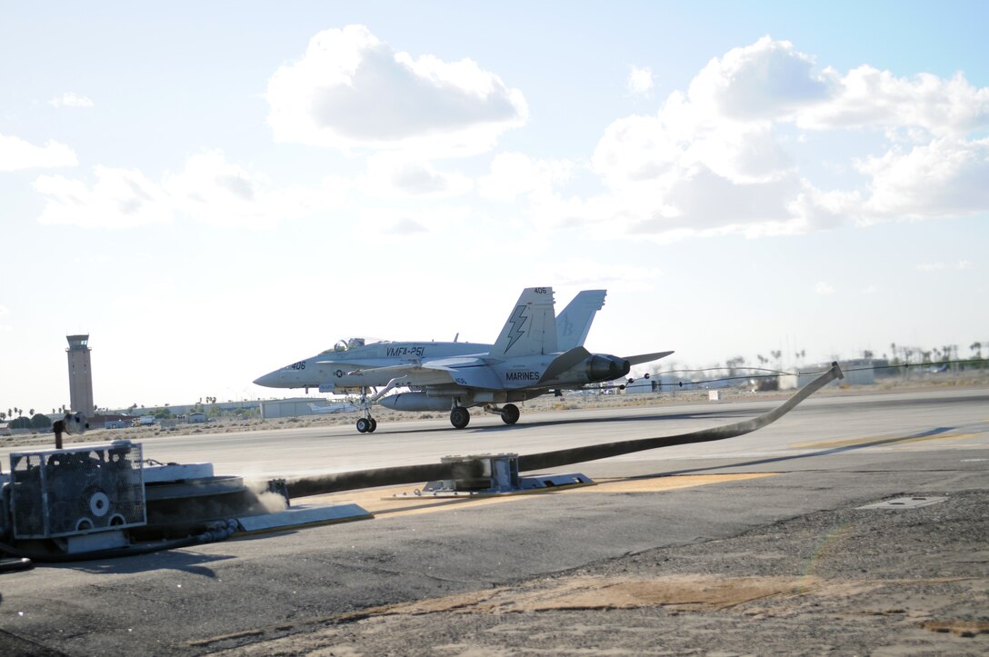 An F/A-18 Hornet with Marine Fighter Attack Squadron 251 from Beaufort, S.C., practices an emergency landing in order to test arresting gear on the flight line at the Marine Corps Air Station in Yuma, Ariz., Oct. 3, 2009. Emergency aircraft recovery Marines recently repaired the plane-stopping arresting gear on the flight line in July, and this was the first opportunity they had to test it. The gear is used to rapidly decelerate an aircraft in an emergency, stopping it within 900 feet.