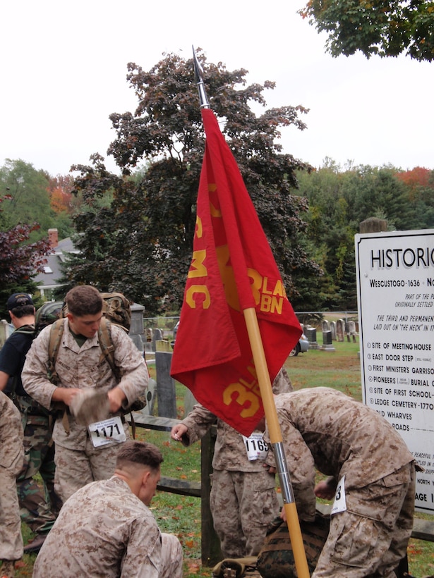 Marines from Company B, 3rd Light Armored Reconnaissance Battalion, stop to rest during the Maine Marathon Tribute March Oct. 4 in Portland, Maine. Although the marathon is in its 18th consecutive year, the Tribute March has only been an even for four years.