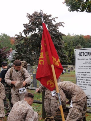 Marines from Company B, 3rd Light Armored Reconnaissance Battalion, stop to rest during the Maine Marathon Tribute March Oct. 4 in Portland, Maine. Although the marathon is in its 18th consecutive year, the Tribute March has only been an even for four years.