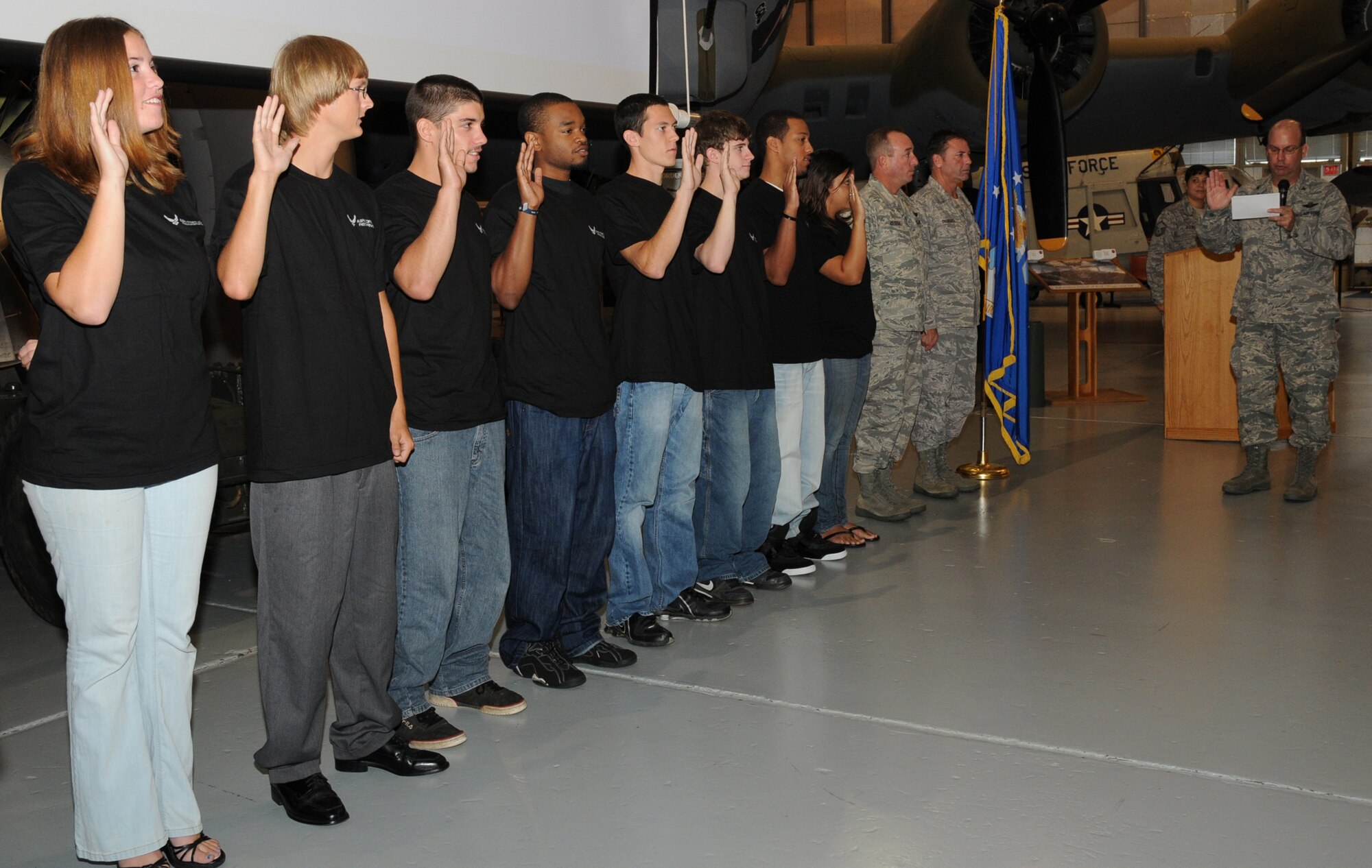 The 512th Airlift Wing held a mass enlistment ceremony at 8:15 a.m. Oct. 3 at the Air Mobility Command Museum here. 512th Airlift Wing Commander Col. Michael T. Fitzhenry administered the oath of enlistment to eight Delawareans at a ceremony  before a crowd of civilian employers of reservists, participating in Employer Appreciation Day. This mass enlistment ceremony is part of a nationwide effort to hold enlistment ceremonies throughout the Air Force Reserve Command in October. (U.S. Air Force photo/Staff Sgt. Steve Lewis) 
