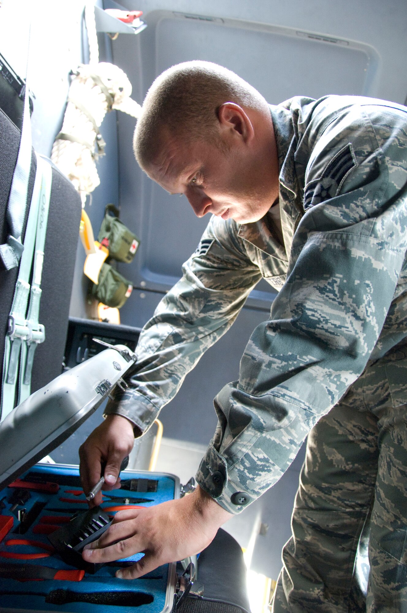 They have the tools, and they have the talent. Senior Airman Erik Waters, 403rd Avionics Flight instruments/flight control systems specialist, searches through his flightline tool kit for a screwdriver to open and inspect the color multi-function display unit (CMFD). This unit acts as a "window into the aircraft," providing situational awareness for the flight crews on the C-130J models. Airman Waters has been on active duty orders at Kessler Air Force base since July as a part of the Avionics Flight Seasonal Training Program. This program offers a year's worth of hands-on experience to avionics tech. school graduates, providing them with an excellent opportunity to become more familiar with the work they perform on the C-130Js.