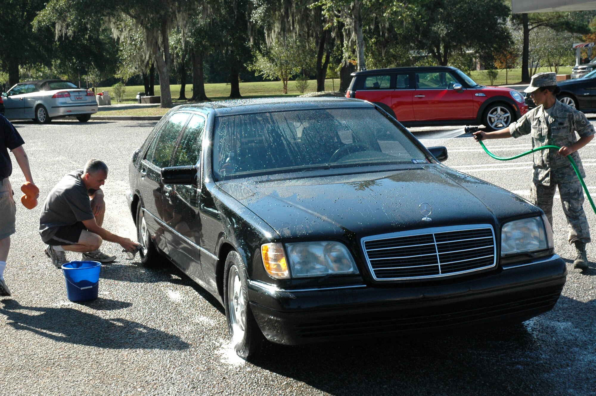 Col. Steven J. Chapman, Wing Commander, 315th Airlift Wing and Tech Sgt. Sonji Piefke, 315th Airlift Wing Client Support Administrator, wash a car at a carwash on Saturday at the Charleston Air Force Base Shopette to help raise money for the Combined Federal Campaign. CFC is the world's largest and most successful annual workplace charity campaign, with more than 300 CFC campaigns throughout the country and internationally to help to raise millions of dollars each year. 