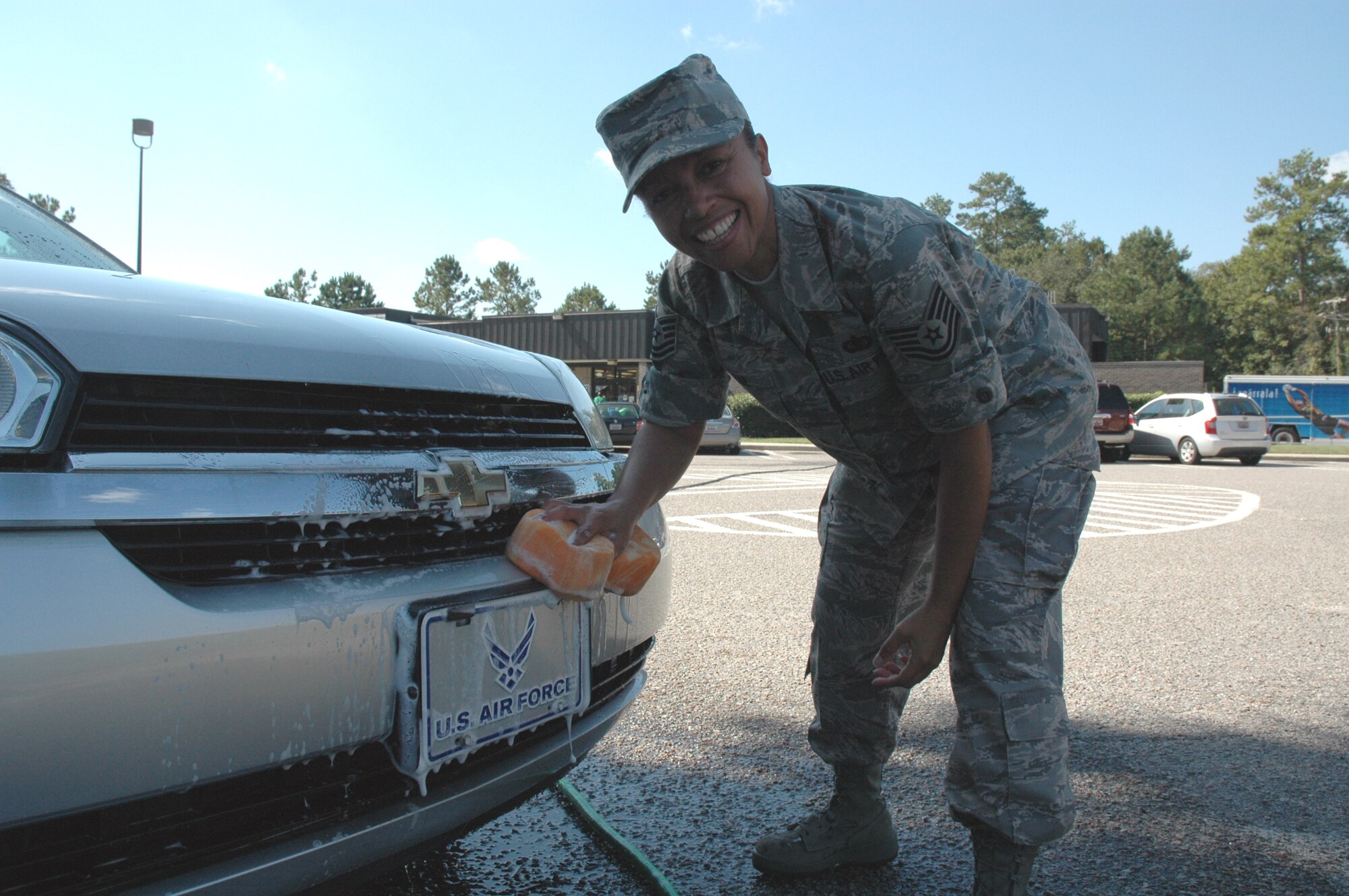 Tech Sgt. Sonji Piefke, 315th Airlift Wing Client Support Administrator, washes a car at a carwash on Saturday at the Charleston Air Force Base Shopette to help raise money for the Combined Federal Campaign. CFC is the world's largest and most successful annual workplace charity campaign, with more than 300 CFC campaigns throughout the country and internationally to help to raise millions of dollars each year. 