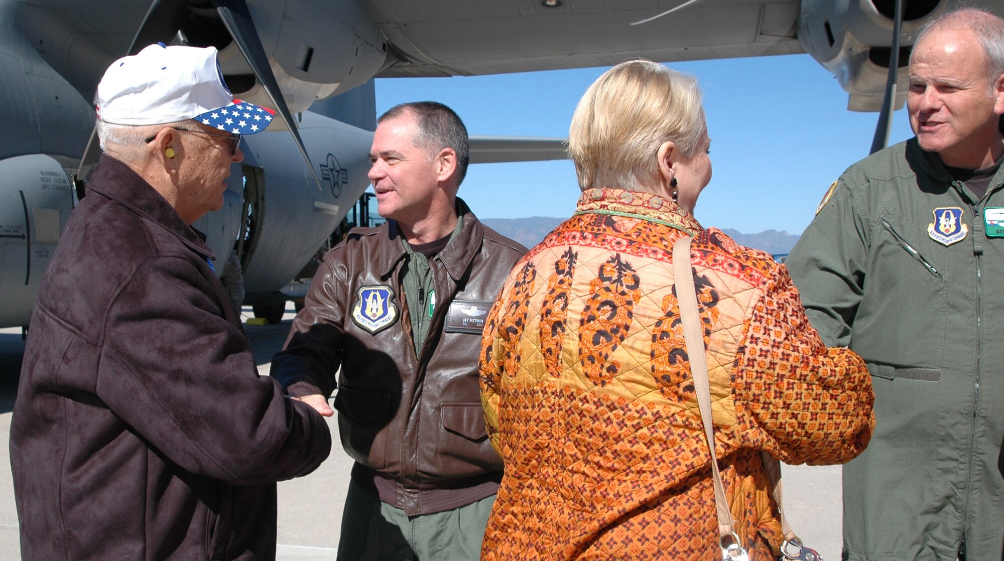 Cols. Jay Pittman (center) and Bob Chapman (right) greet civic leaders from Little Rock, Ark., during a 19th Airlift Wing Community Relations Tour Oct. 2 at Peterson Air Force Base, Colo. The civic leaders, who lend their community support to Little Rock AFB, Ark., visited the 302nd AW to gain a better perspective on how the Air Force Reserve and its Active Duty counterparts work together. Colonel Pittman is the 302nd AW commander and Colonel Chapman is the wing's vice commander. (U.S. Air Force photo/Staff Sgt. Stephen J. Collier)