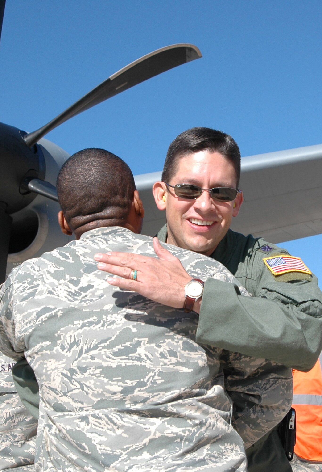 Lt. Col. Carlos Ortiz (right) welcomes Chief Master Sgt. Anthony Brinkley from Little Rock Air Force Base, Ark., during a 19th Airlift Wing Community Relations Tour Oct. 2 at Peterson Air Force Base, Colo. Chief Brinkley was joined by Little Rock-area civic leaders who lend their community support to Little Rock AFB. At Peterson, the group visited the 302nd AW to gain a better perspective on how the Air Force Reserve and its Active Duty counterparts work together. Colonel Ortiz is the 52nd Airlift Squadron commander; Chief Brinkley is the 19th AW command chief. (U.S. Air Force photo/Staff Sgt. Stephen J. Collier)
