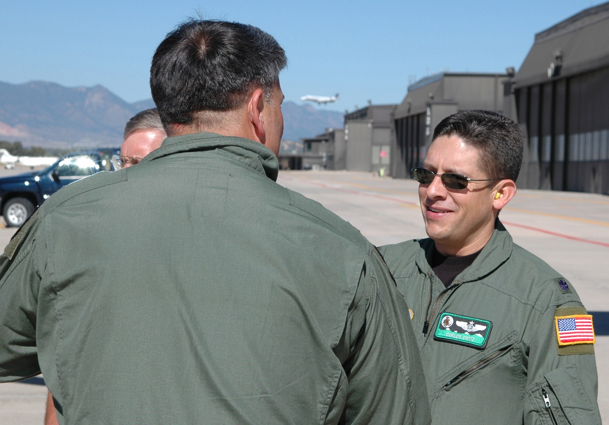 Lt. Col. Carlos Ortiz (right) welcomes Col. Gregory Otey from Little Rock Air Force Base, Ark., during a 19th Airlift Wing Community Relations Tourr Oct. 2 at Peterson Air Force Base, Colo. Colonel Otey, the 19th AW commander, was joined by Little Rock-area civic leaders who lend their community support to Little Rock AFB. At Peterson, the group visited the 302nd AW to gain a better perspective on how the Air Force Reserve and its Active Duty counterparts work together. Colonel Ortiz is the 52nd Airlift Squadron commander. (U.S. Air Force photo/Staff Sgt. Stephen J. Collier)