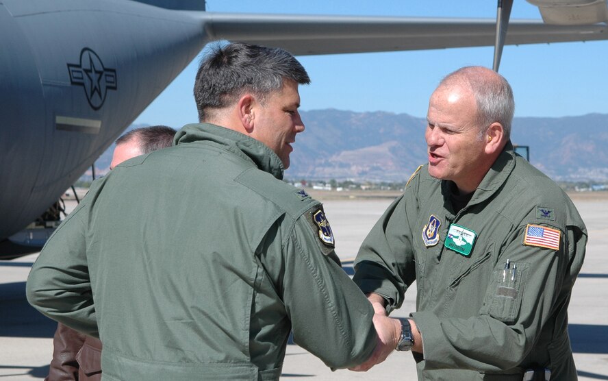 Col. Bob Chapman (right) welcomes Col. Gregory Otey from Little Rock Air Force Base, Ark., during a 19th Airlift Wing Community Relations Tour Oct. 2 at Peterson Air Force Base, Colo. Colonel Otey, 19th AW commander, was joined by Little Rock-area civic leaders who lend their community support to Little Rock AFB. At Peterson, the group visited the 302nd AW to gain a better perspective on how the Air Force Reserve and its Active Duty counterparts work together. Colonel Chapman is the 302nd AW vice commander. (U.S. Air Force photo/Staff Sgt. Stephen J. Collier)