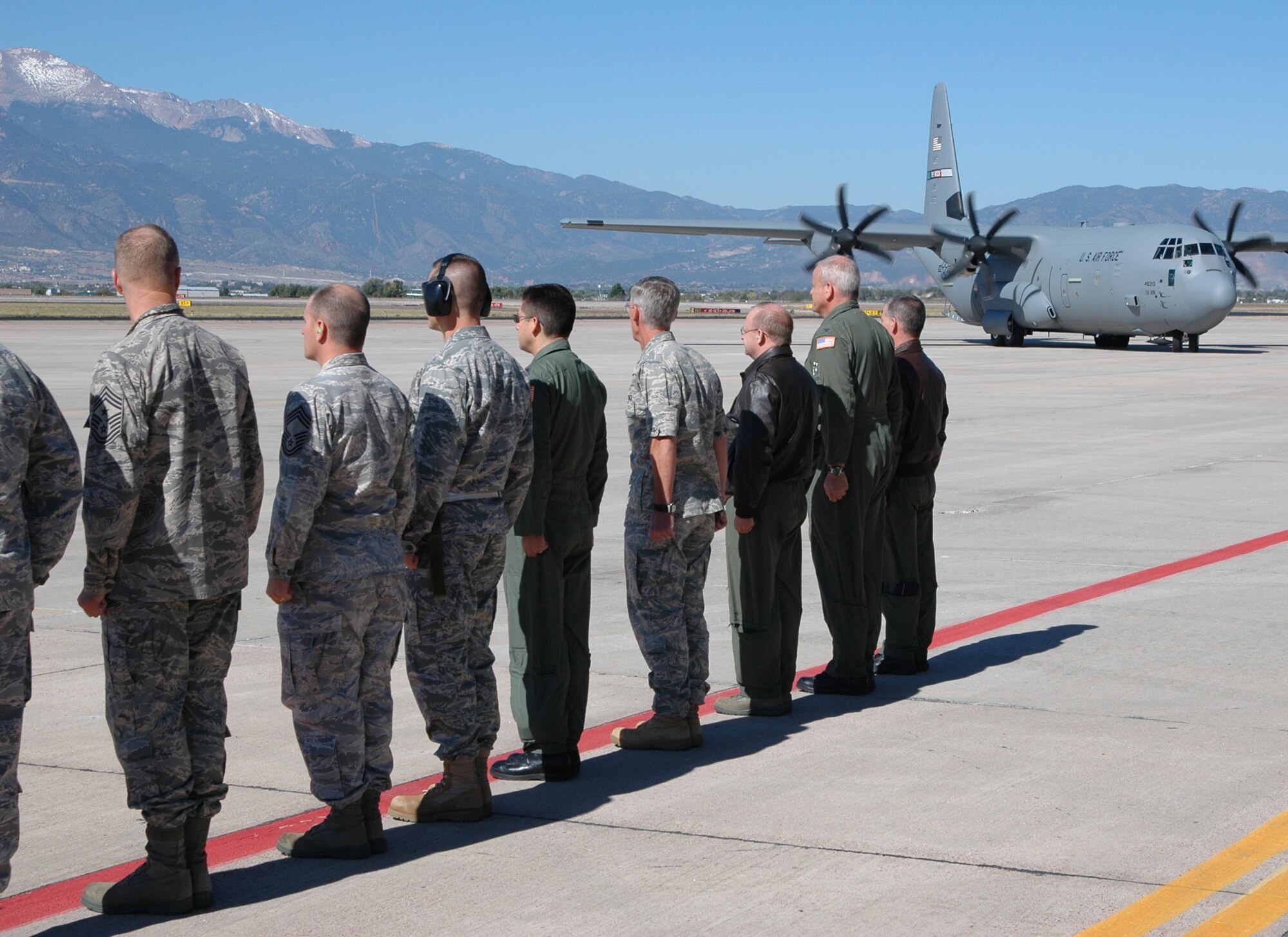 An official party from the 302nd Airlift Wing welcomes civic leaders from Little Rock Air Force Base, Ark., during a 19th Airlift Wing Community Relations Tour Oct. 2 at Peterson Air Force Base, Colo. The Little Rock, Ark.-area civic leaders, who lend their community support to Little Rock AFB, visited the 302nd AW to gain a better perspective on how the Air Force Reserve and its Active Duty counterparts work together. Sergeant Vossmer is the 52nd Airlift Squadron first sergeant. (U.S. Air Force photo/Staff Sgt. Stephen J. Collier)