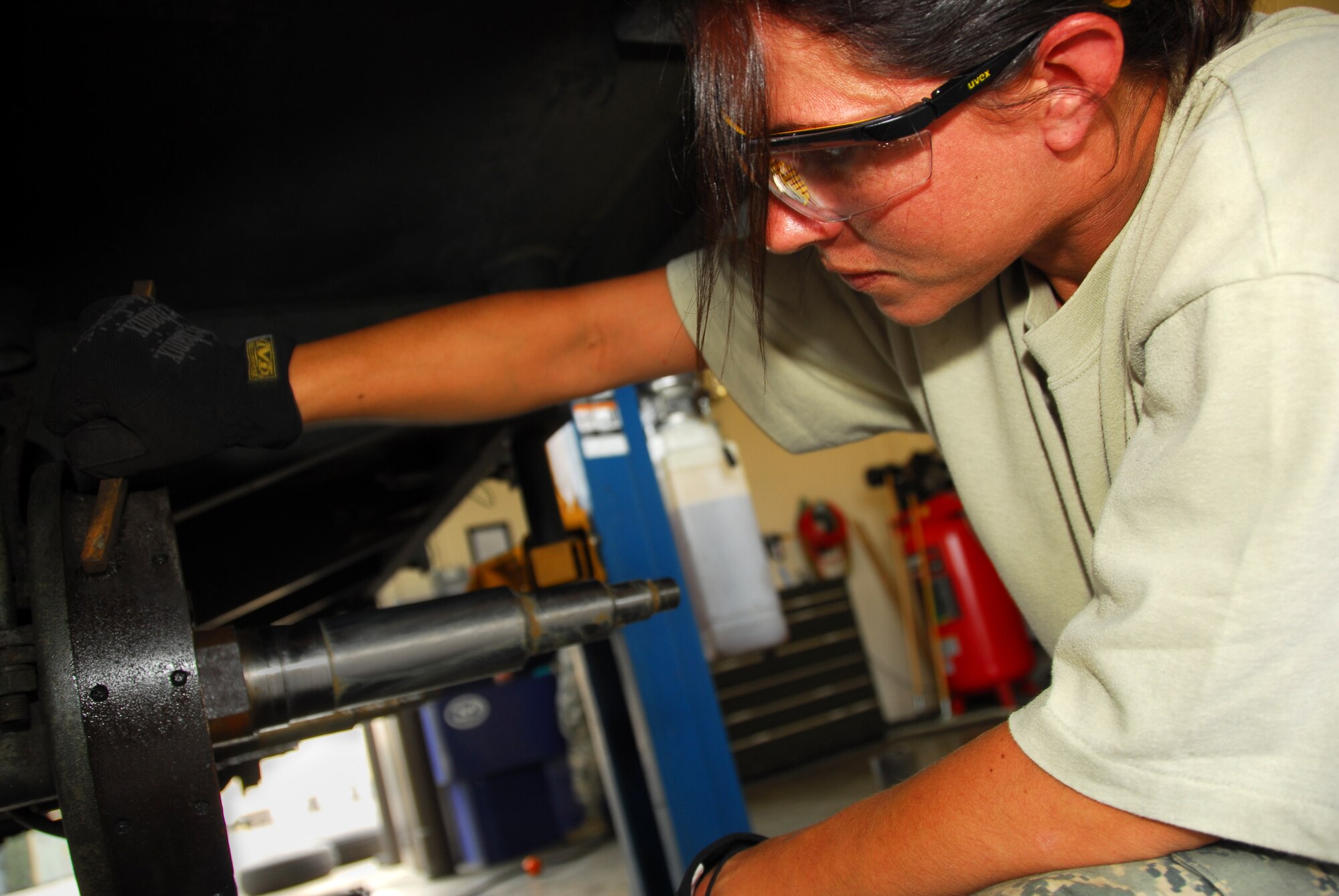 Senior Airman Teri Diemel, a munitions system apprentice with the 115th Fighter Wing, Madison, Wis. performs routine servicing on a munitions trailer.