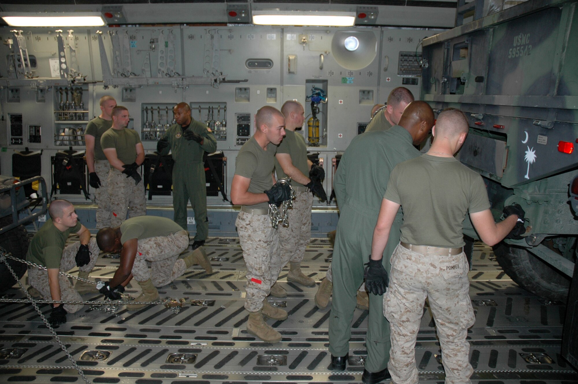 Members of the 315th Airlift Wing Airlift Control Flight conducted a joint training excercise with members of the Marine Corps Reserve 4th Marine Logistics Group, 4th Landing Support Battalion on Sunday. The training focused mainly on uploading heavy equipment to static aircraft and exemplifies the military's dedication to joint wartime readiness. (U.S. Air Force photo/Tech. Sgt. Jeff Kelly)