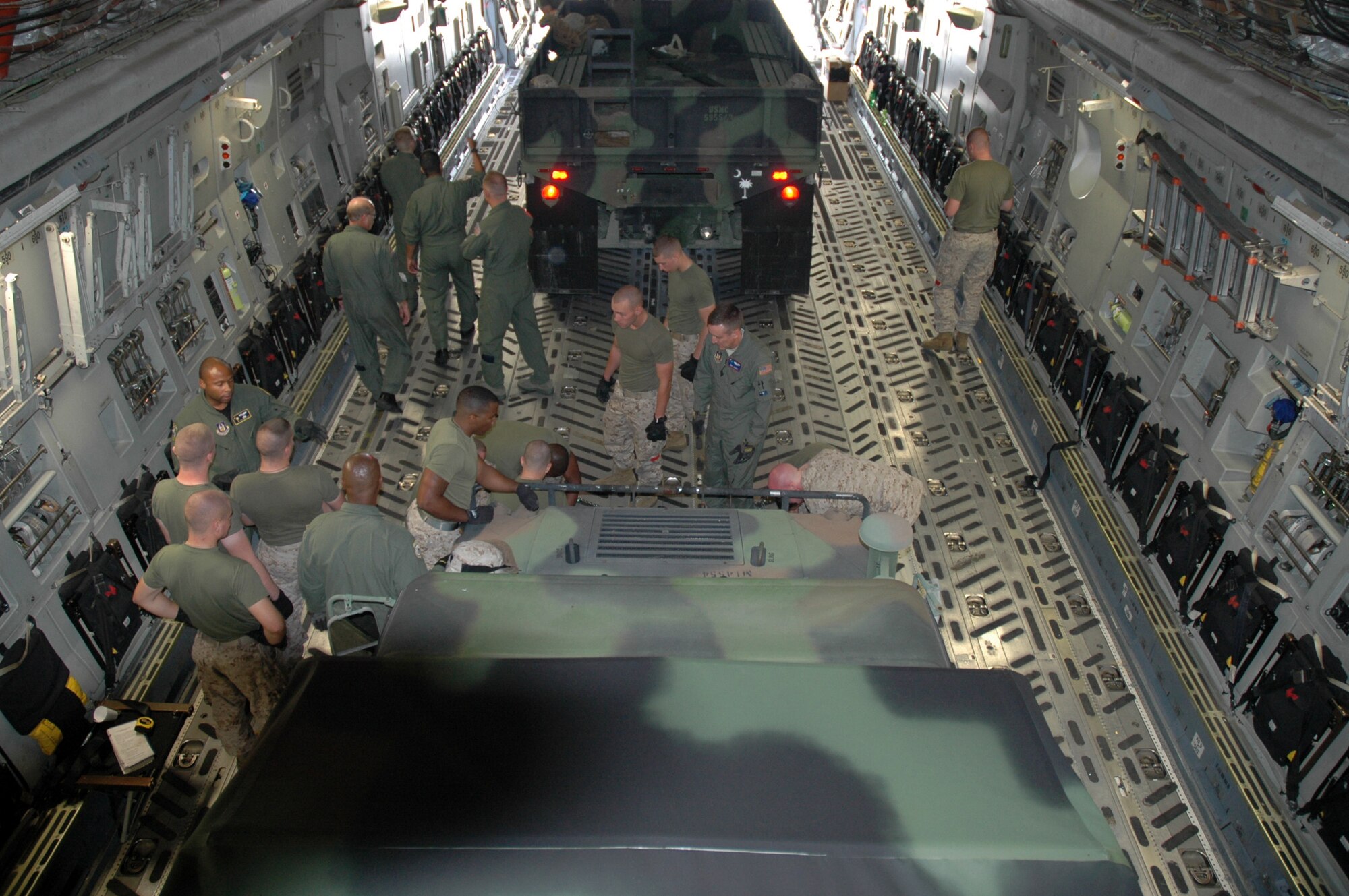 Members of the 315th Airlift Wing Airlift Control Flight conducted a joint training excercise with members of the Marine Corps Reserve 4th Marine Logistics Group, 4th Landing Support Battalion on Sunday. The training focused mainly on uploading heavy equipment to static aircraft and exemplifies the military's dedication to joint wartime readiness. (U.S. Air Force photo/Tech. Sgt. Jeff Kelly)