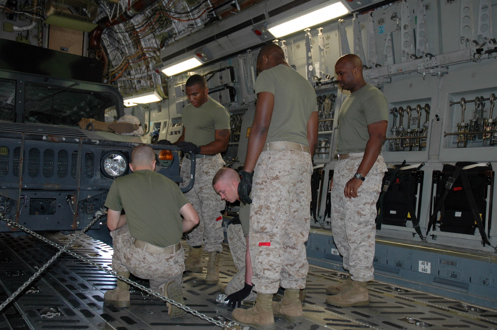 Members of the 315th Airlift Wing Airlift Control Flight conducted a joint training excercise with members of the Marine Corps Reserve 4th Marine Logistics Group, 4th Landing Support Battalion on Sunday. The training focused mainly on uploading heavy equipment to static aircraft and exemplifies the military's dedication to joint wartime readiness. (U.S. Air Force photo/Tech. Sgt. Jeff Kelly)