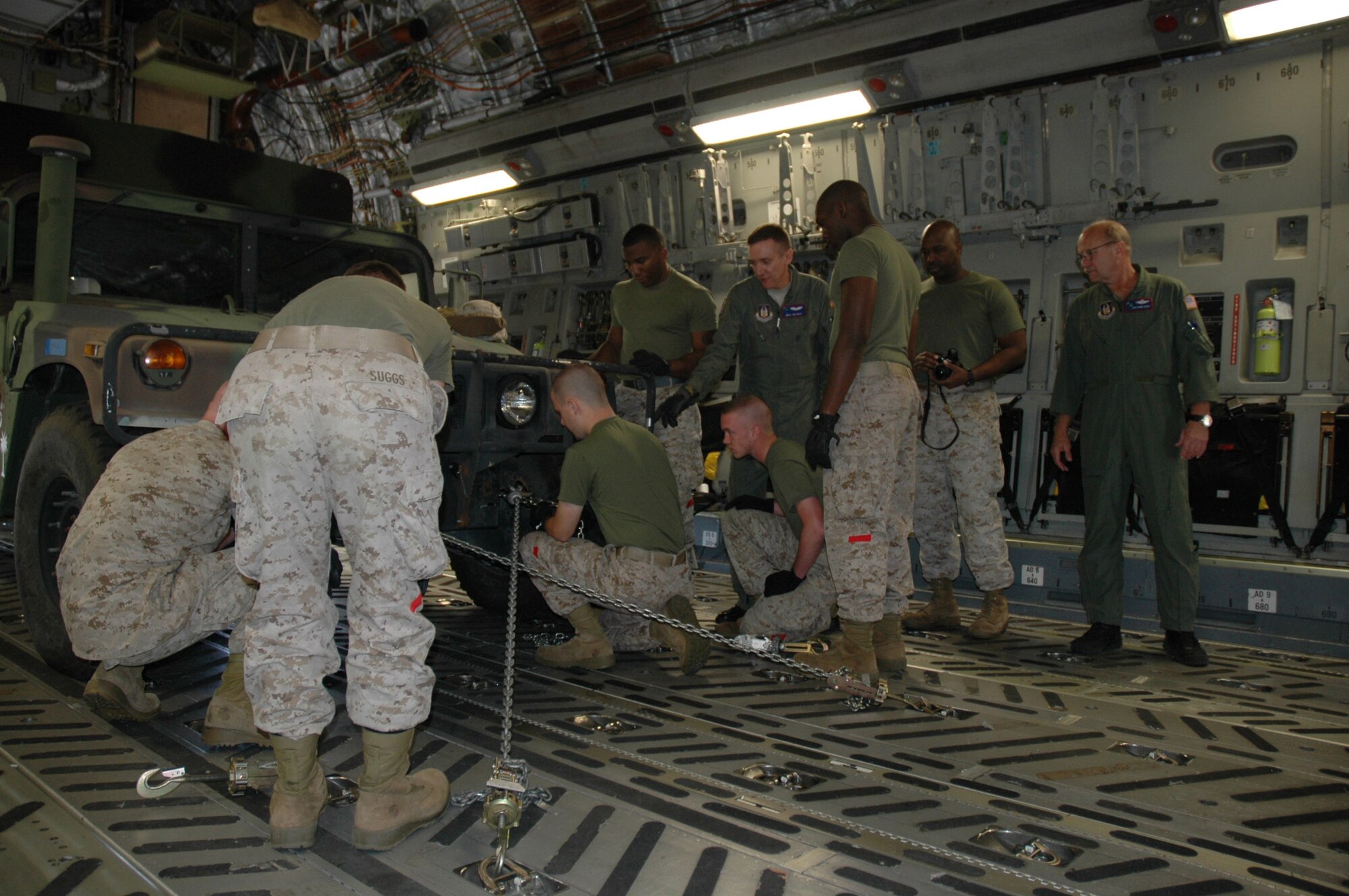 Members of the 315th Airlift Wing Airlift Control Flight conducted a joint training excercise with members of the Marine Corps Reserve 4th Marine Logistics Group, 4th Landing Support Battalion on Sunday. The training focused mainly on uploading heavy equipment to static aircraft and exemplifies the military's dedication to joint wartime readiness. (U.S. Air Force photo/Tech. Sgt. Jeff Kelly)