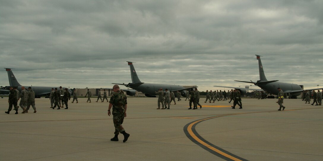 Members of the 108th found themselves out on the line early on Sunday of the September UTA, looking for FOD - the enemy of aircraft.  Photo by Staff Sgt. Armando Vasquez, the 108th Public Affairs office.