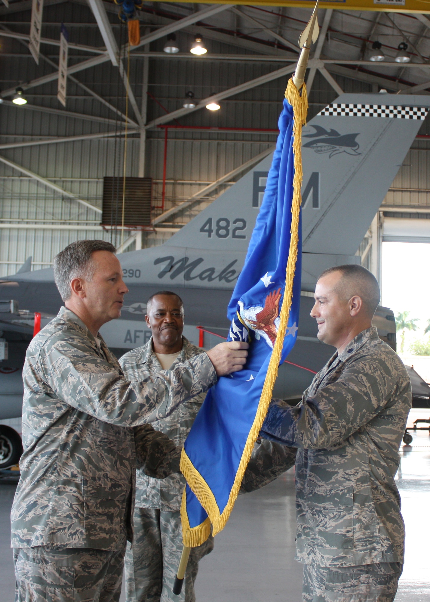 Lt. Col. Michael Reid assumes command of the 482nd Maintenance Group during a change of command ceremony at Hangar 200 on Sunday, Oct. 3. 