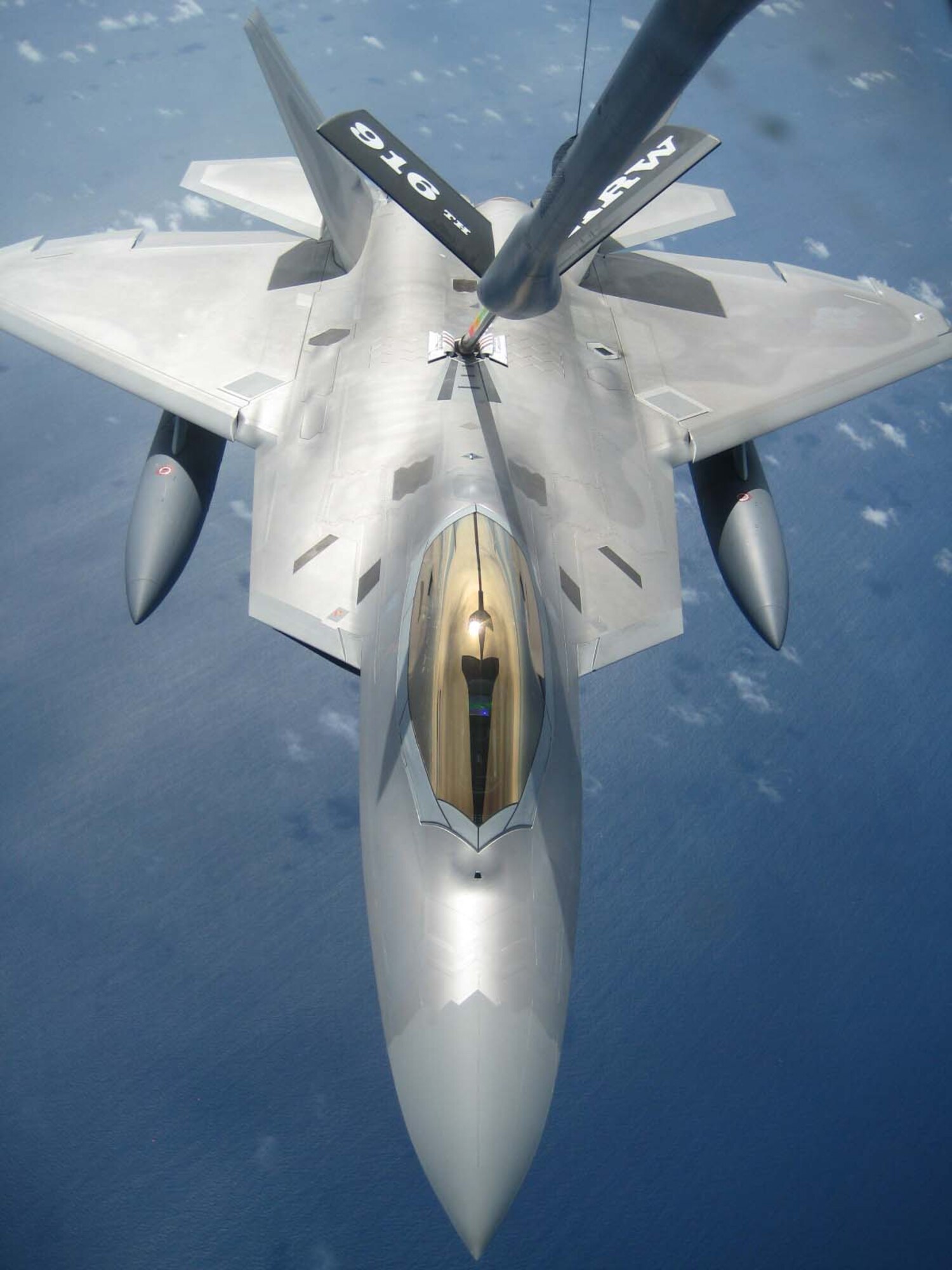 SEYMOUR JOHNSON AIR FORCE BASE, N.C. -- A KC-135R Stratotanker from the 916th Air Refueling Wing, Air Force Reserve, refuels an F-22 Raptor off the coast of Guam.