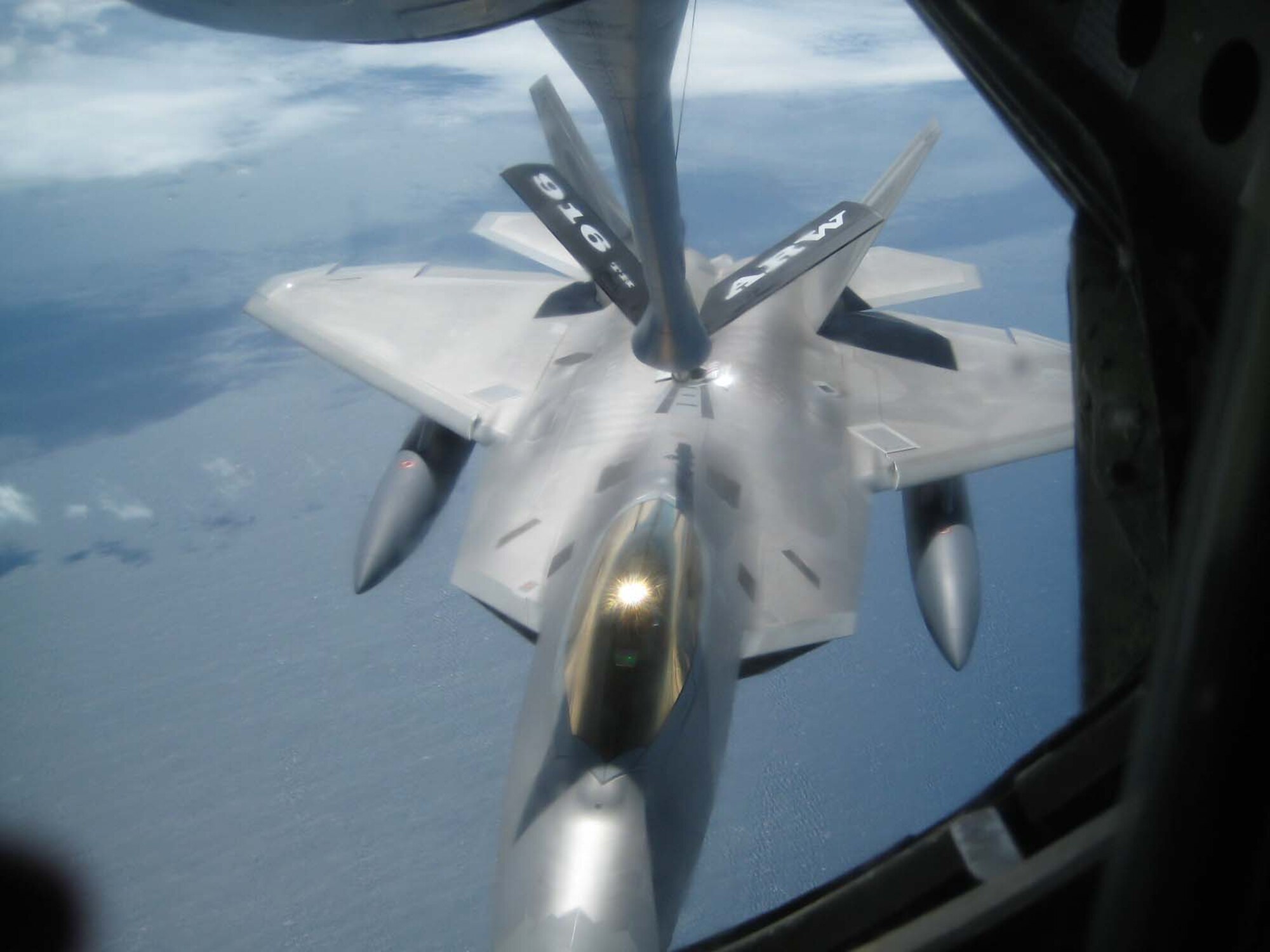 SEYMOUR JOHNSON AIR FORCE BASE, N.C. --  A KC-135R from the 916th Air Refueling Wing offloads fuel to an F-22 Raptor in the Pacific. More than 100 reservists and active duty Airmen are currently deployed to Guam.