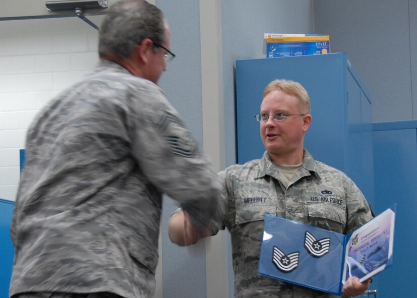 Newly promoted Tech. Sgt. Troy Mellott, 919th Maintenance Squadron, gets congratulated by Chief Master Sgt. Jeff Fitzgerald, 919th MXS, Oct. 3 at Duke Field.  Sergeant Mellott was promoted via the Air Force Reserve’s Promotion Enhancement Program.  (U.S. Air Force photo/Staff Sgt. Samuel King Jr.)