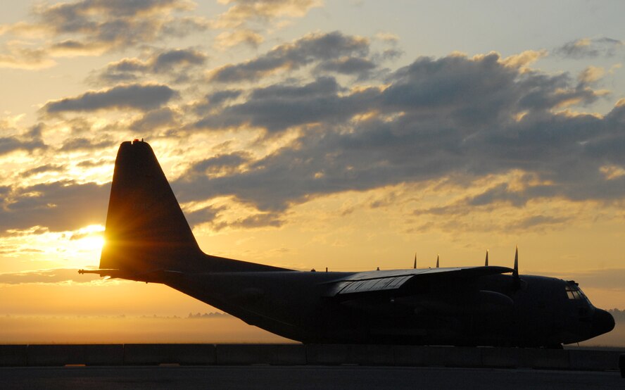 The sun breaks over the tail of a 919th Special Operations Wing MC-130E Combat Talon I Oct. 3 morning at Duke Field, Fla.  The sun brought light to the first UTA weekend in the new fiscal year for the Reserve unit.  (U.S. Air Force photo/Staff Sgt. Samuel King Jr.) 