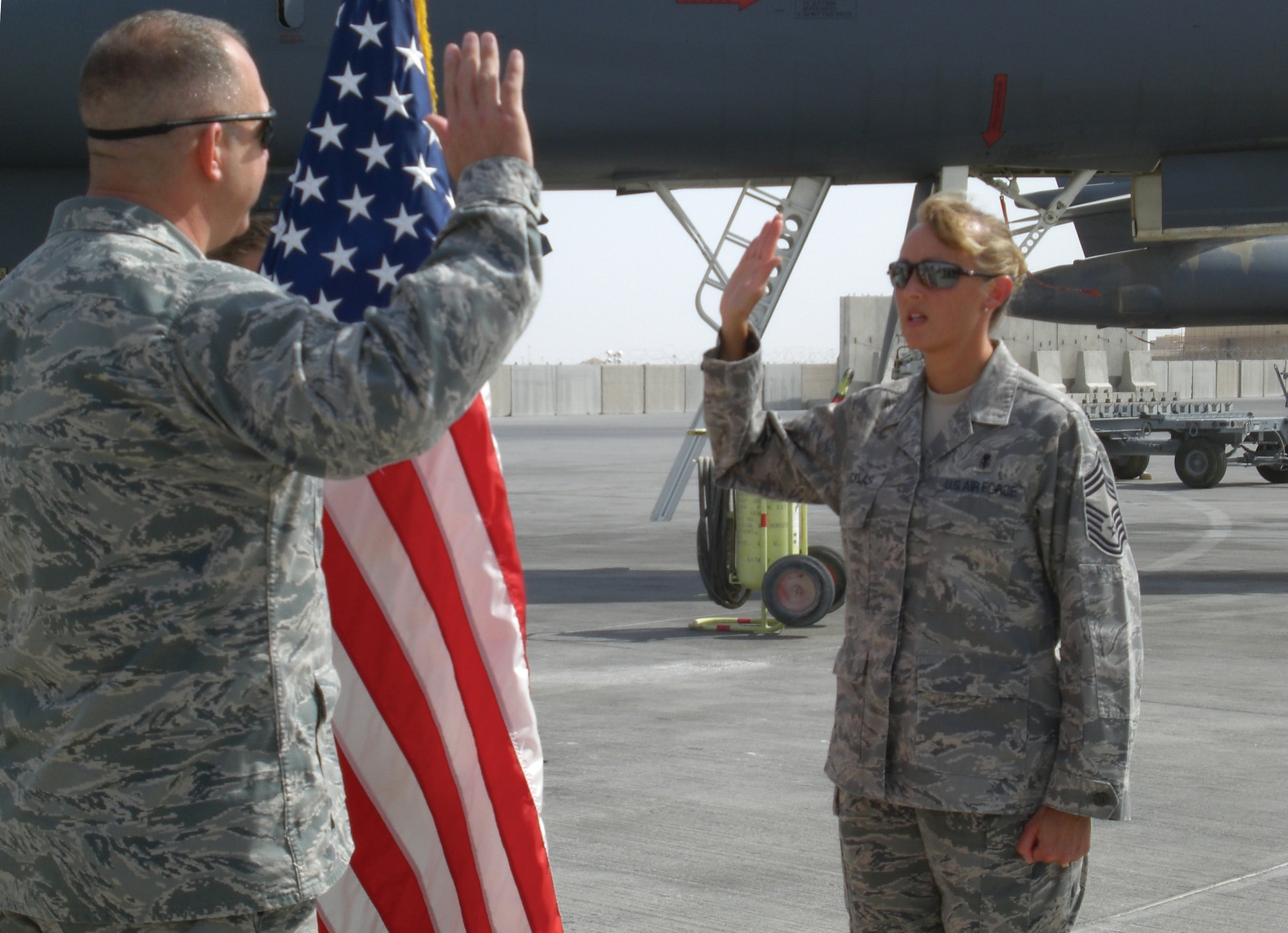 Chief Master Sgt. Veronique Nicklas, 379th Expeditionary Medical Group superintendent, takes her final oath of enlistment, Sept. 26, on the flightline in Southwest Asia. This was Chief Nicklas’ final oath before reaching 30 years of service in the U.S. Air Force. (Courtesy photo)