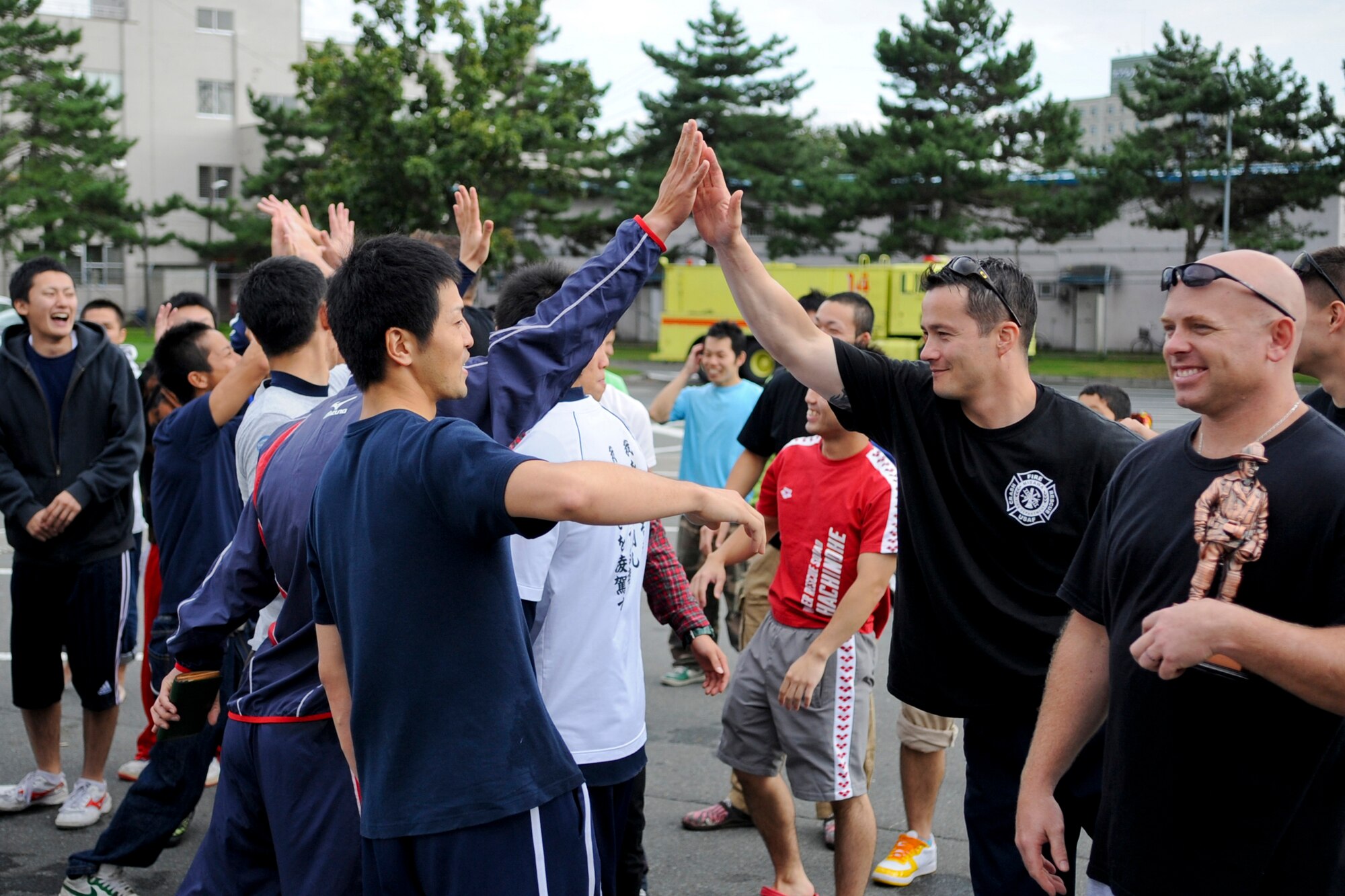 MISAWA AIR BASE, Japan -- Competitors of the Annual Misawa Air Base Fire Muster competition congratulate each other Oct. 4 at the Base Exchange. Fire departments from Misawa Air Base, Hachinohe and Towada competed against each other as part of Fire Prevention Week. (U.S. Air Force photo by Senior Airman Jamal D. Sutter)