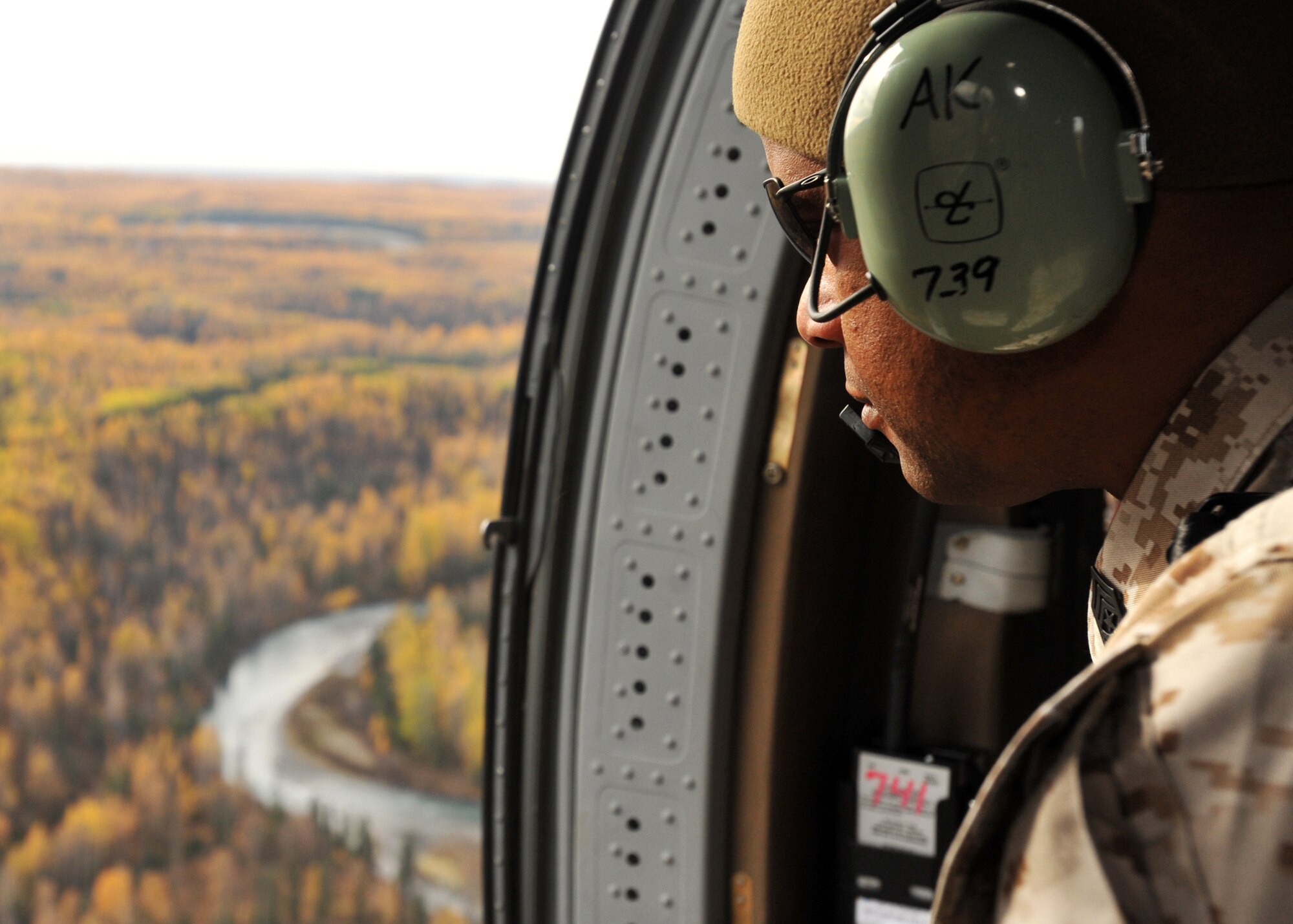 ELMENDORF AIR FORCE BASE, Alaska -- Marine Forces Reserve Sgt. Maj. Kim E. Davis looks through the window of a UH-60 Blackhawk from the Alaska Army National Guard Oct. 2, 2009. Sgt. Maj. Davis was here to see the mission of Marines stationed on Ft. Richardson to better understand their impact on Alaska. (U.S. Air Force photo/Senior Airman Laura Turner)