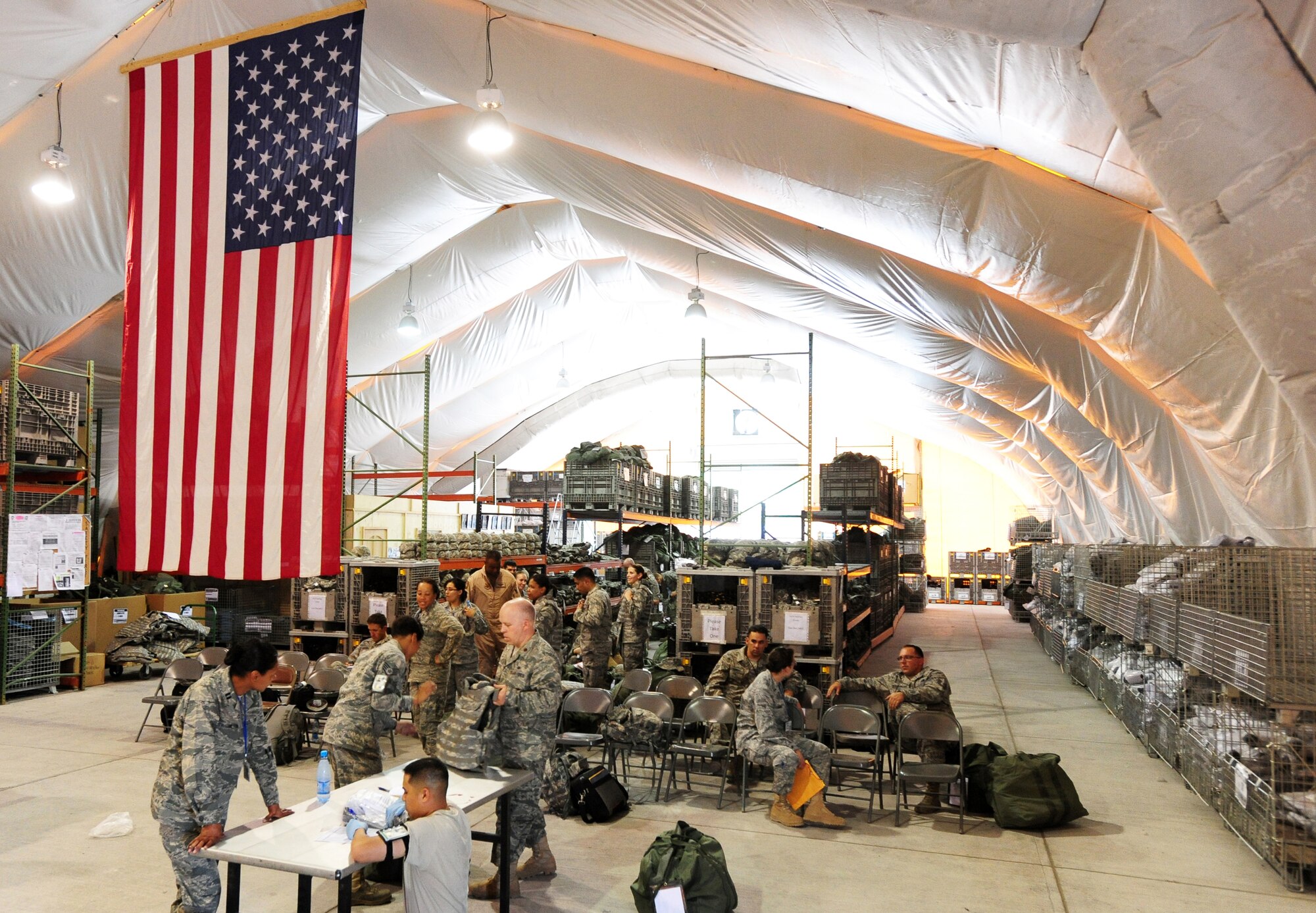 The 376th Expeditionary Theater Distribution Center at Manas Air Base, Kyrgyzstan processes Airmen in preparation for their deployments to Afghanistan. Equipping troops and ensuring serviceability of gear are vital aspects of today's contingency operations performed by ETDC Airmen every day. (U.S. Air Force photo/Senior Airman Steele Britton)