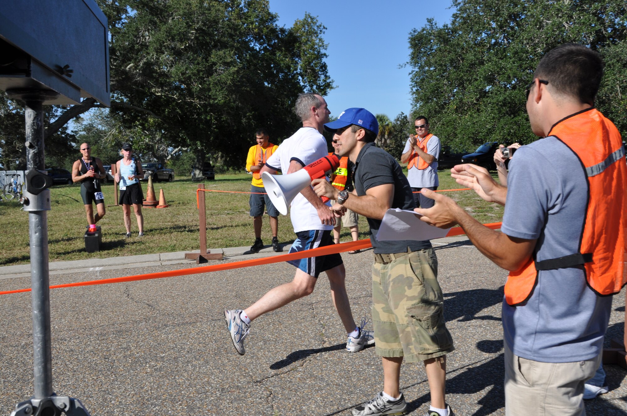 Brig. Gen. Darryl Roberson, 325th Fighter Wing commander, crosses the finish line during the Tynman Tri/Duathlon Oct. 3 here.  (U.S. Air Force photo/Airman 1st Class Veronica McMahon)