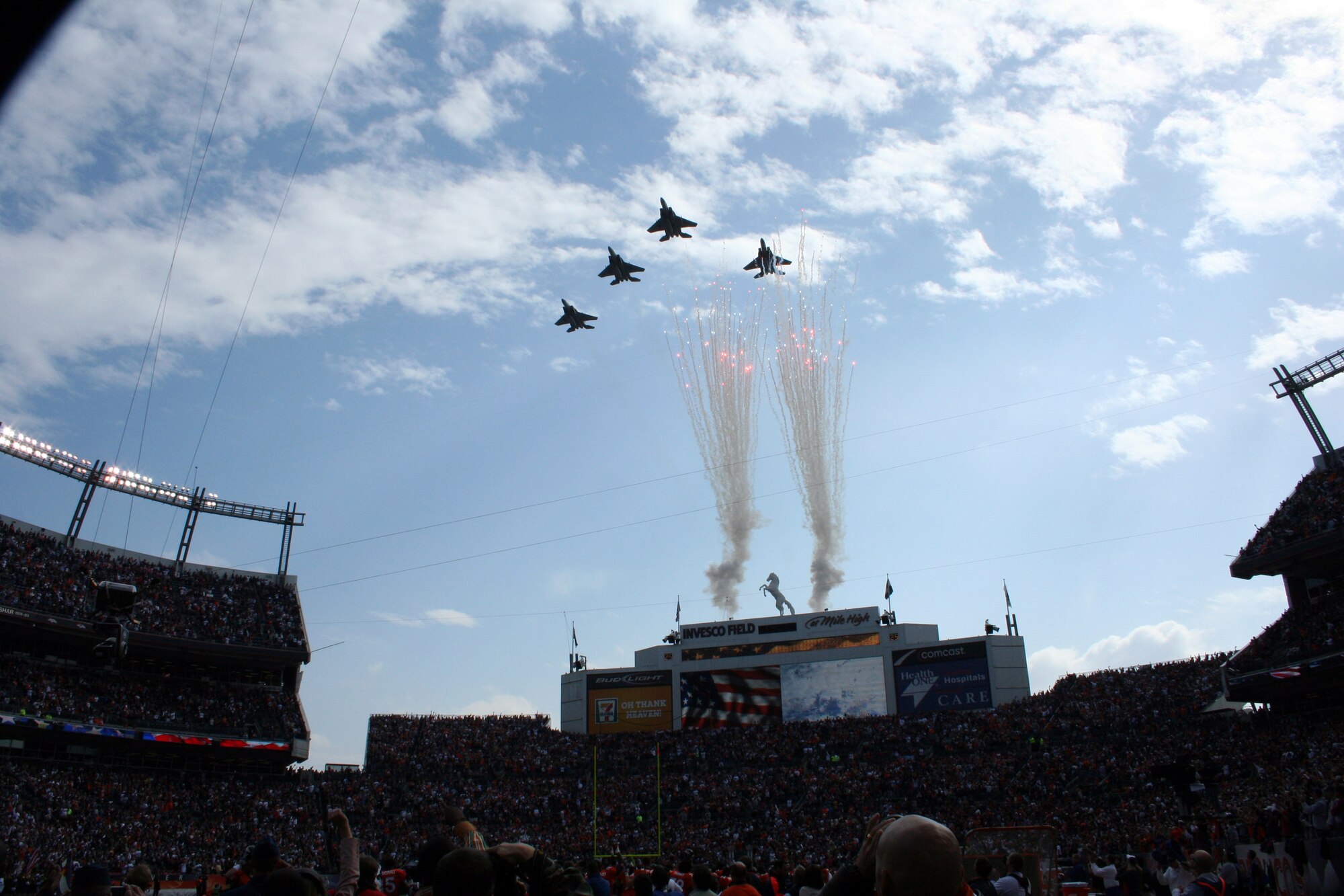 Four F-15s from the Oregon Air National Guard fly over Invesco Stadium at the end of the National Anthem before kickoff at the Denver Broncos game Oct. 4 in Denver, Colo. (U.S. Air Force photo/Capt. Maren P. Barney)
