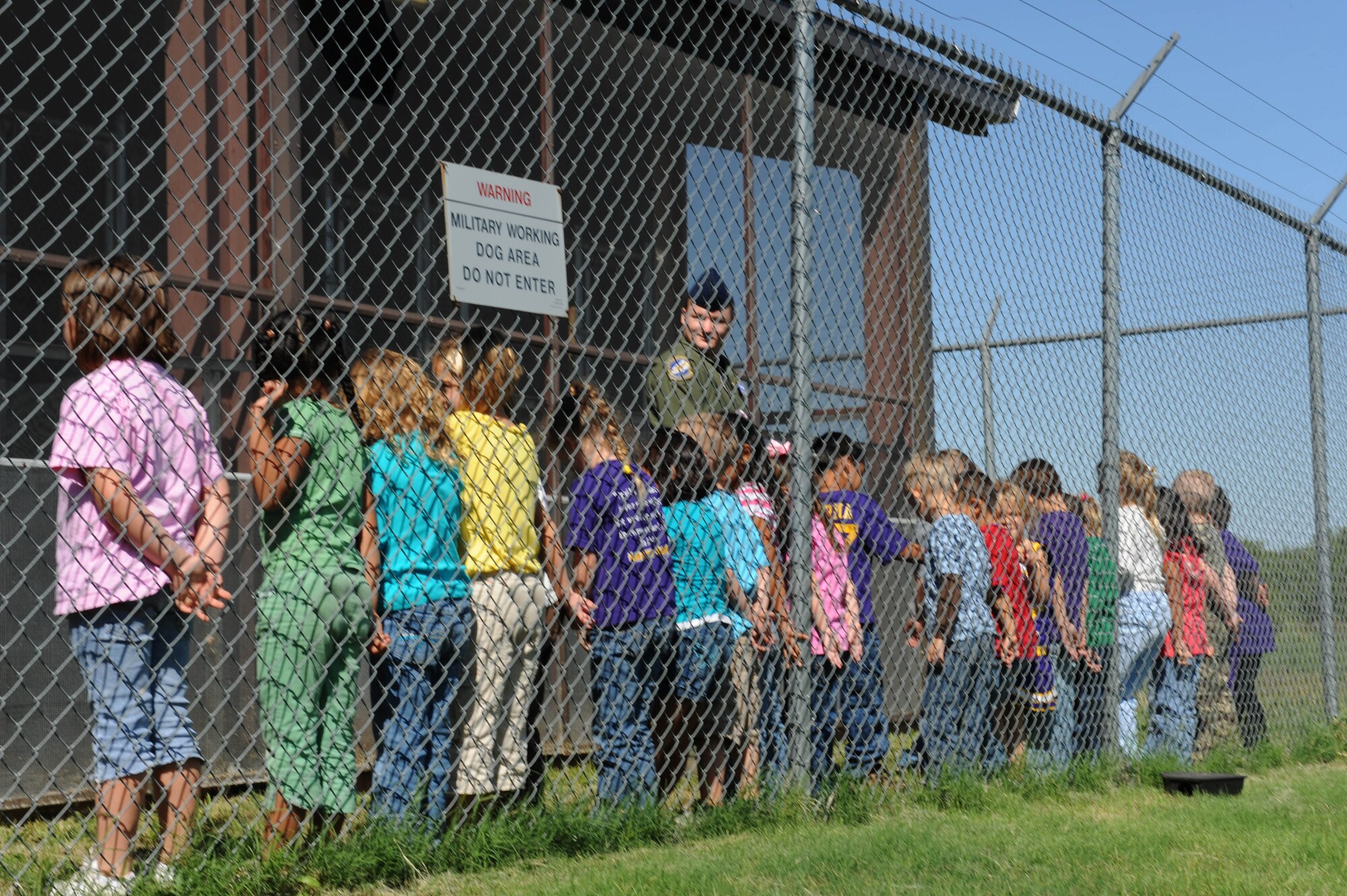 DYESS AIR FORCE BASE, Texas— A Merkel Elementary school kindergarten class line up to walk through the military working dog kennels during a tour here Oct. 2. Approximately 75 students toured Dyess Air Force Base,  and attended a military working dog demonstration. (U.S. Air Force photo by Airman Brittany Prescott)