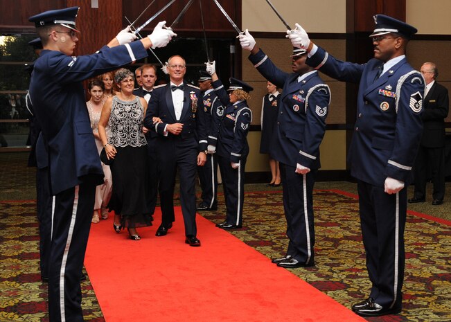 Lt. Gen. Bob Allardice and his wife Susan enter the Air Force Ball through the saber cordon in the North Charleston Convention Center Oct. 3. More than 800 Airmen and community leaders came together to celebrate the 62nd birthday of the United States Air Force. General Allardice is the 18th Air Force commander. (U.S. Air Force photo/Senior Airman Katie Gieratz)