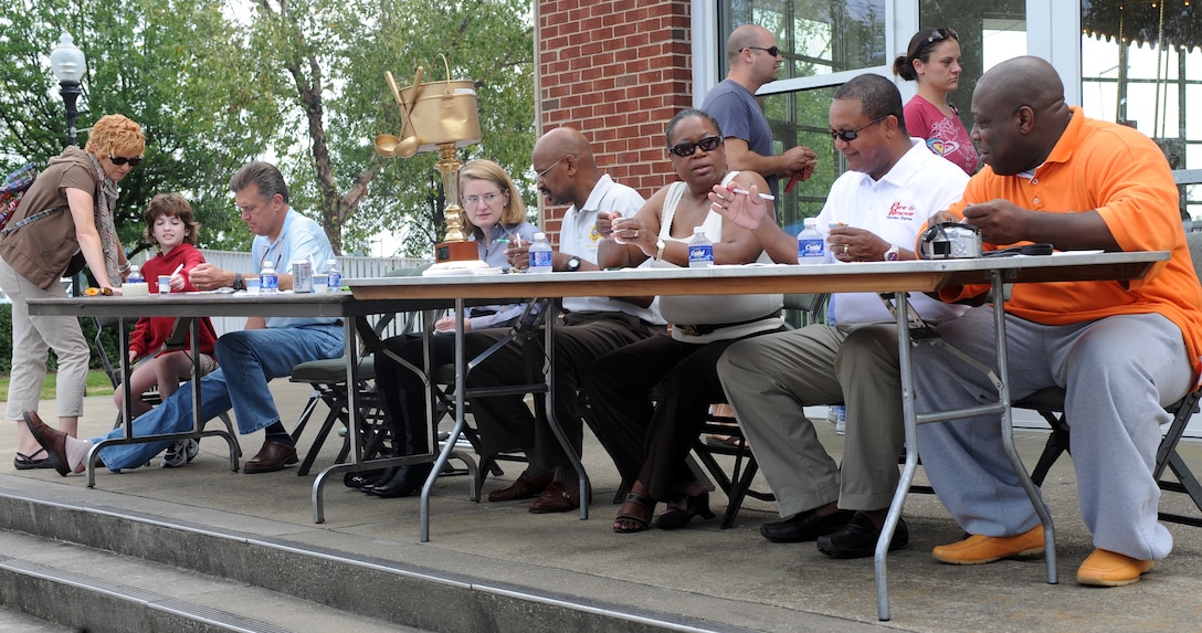 LANGLEY AIR FORCE BASE, Va. -- Judges taste chili in order to determine the best during the annual Hampton Division Fire and Rescue Chili Cook-off in downtown Hampton Oct. 3. The cook-off helped raise money for Hampton City fire prevention, which helps the community by installing free smoke detectors and raising awareness of fire prevention.  (U.S. Air Force photo/Senior Airman Zachary Wolf)
