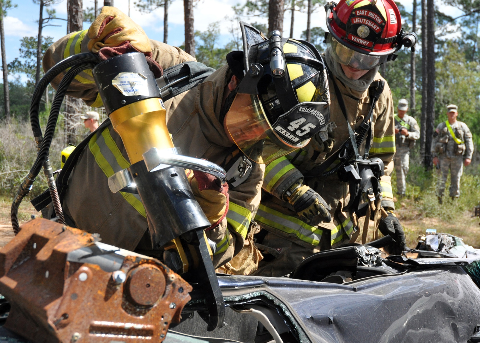 Local area firefighters use the ‘jaws-of-life’ to extract a simulated car accident victim out of the wreckage Oct. 1 during the 6th Ranger Training Battalion’s annual mass casualty exercise.  The exercise was to examine how effective the battalion responds as a group and how well it communicates and works with outside emergency agencies in the event of a catastrophe on Eglin's range.  (U.S. Air Force photo/Airman Anthony Jennings.)