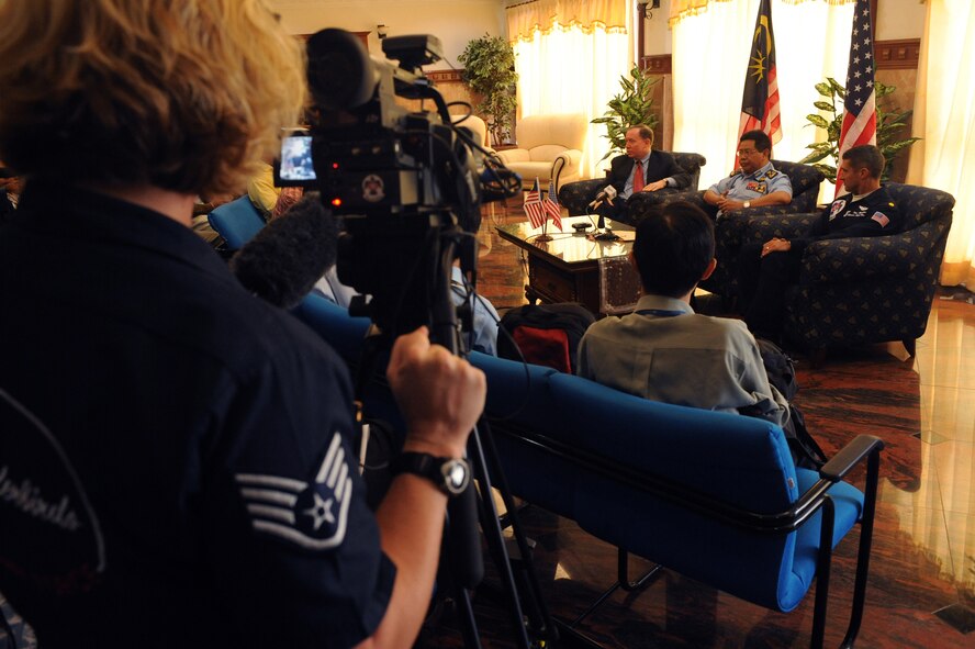 Maj. Tony Mulhare (right), Thunderbird #8, particpates in a press conference with the Malaysian government and media Oct. 1 in Kuala Lumpur, Malaysia. The demontration team participated in the Malaysian air show. The Thunderbirds' tour of the Pacific aids in fostering friendships with U.S. allies, which helps to promote security and stability in the region.  (U.S. Air Force photo/Staff Sgt. Kristi Machado)