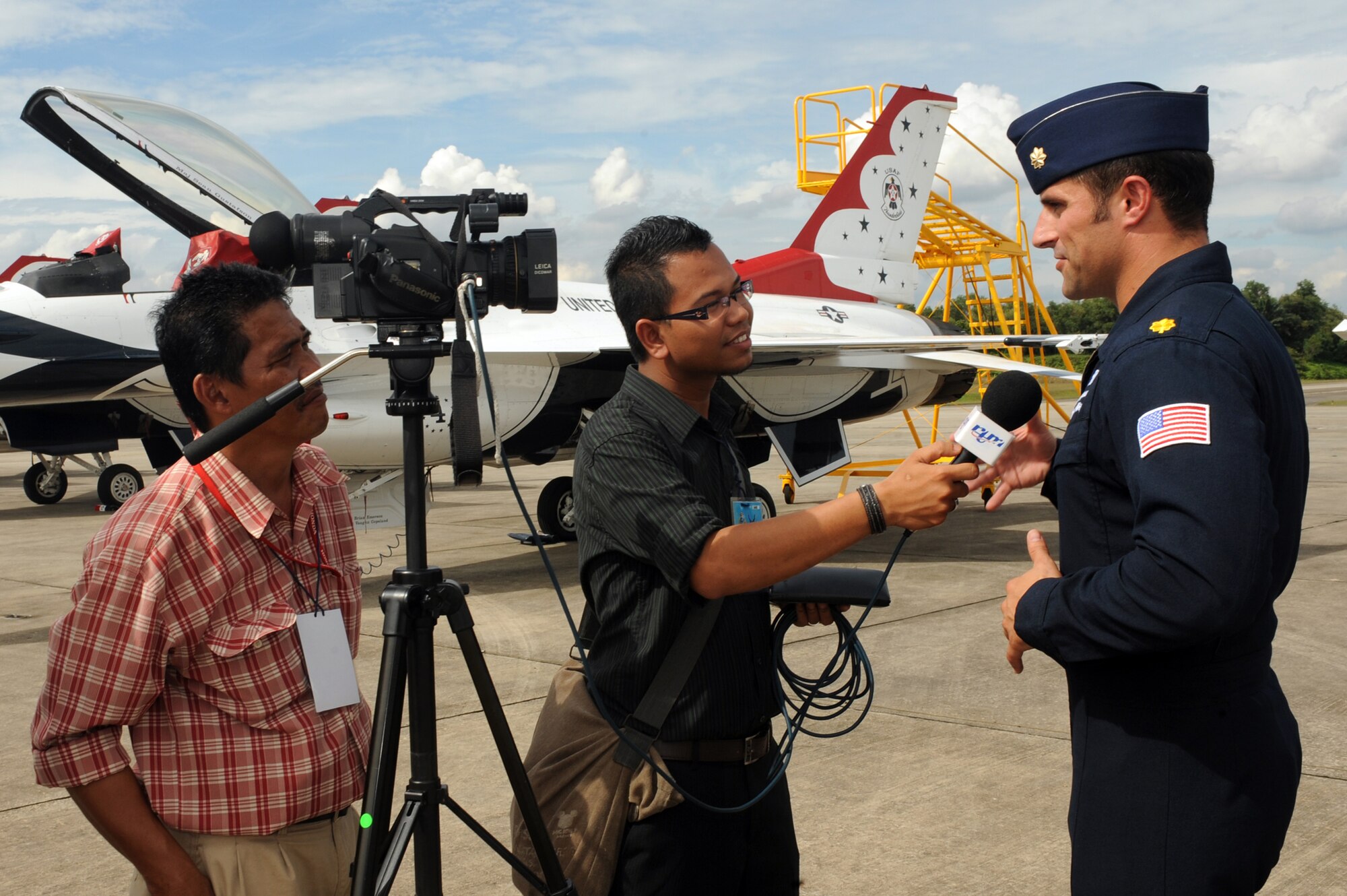 Maj. Kirby Ensser, Thunderbird #3, answers questions for Malaysian media prior to flying in the air show practice, Oct. 1 at Kuala Lumpur, Malaysia. The Thunderbirds' tour of the Pacific aids in fostering friendships with U.S. allies, which helps to promote security and stability in the region. (U.S. Air Force photo/Staff Sgt. Kristi Machado)