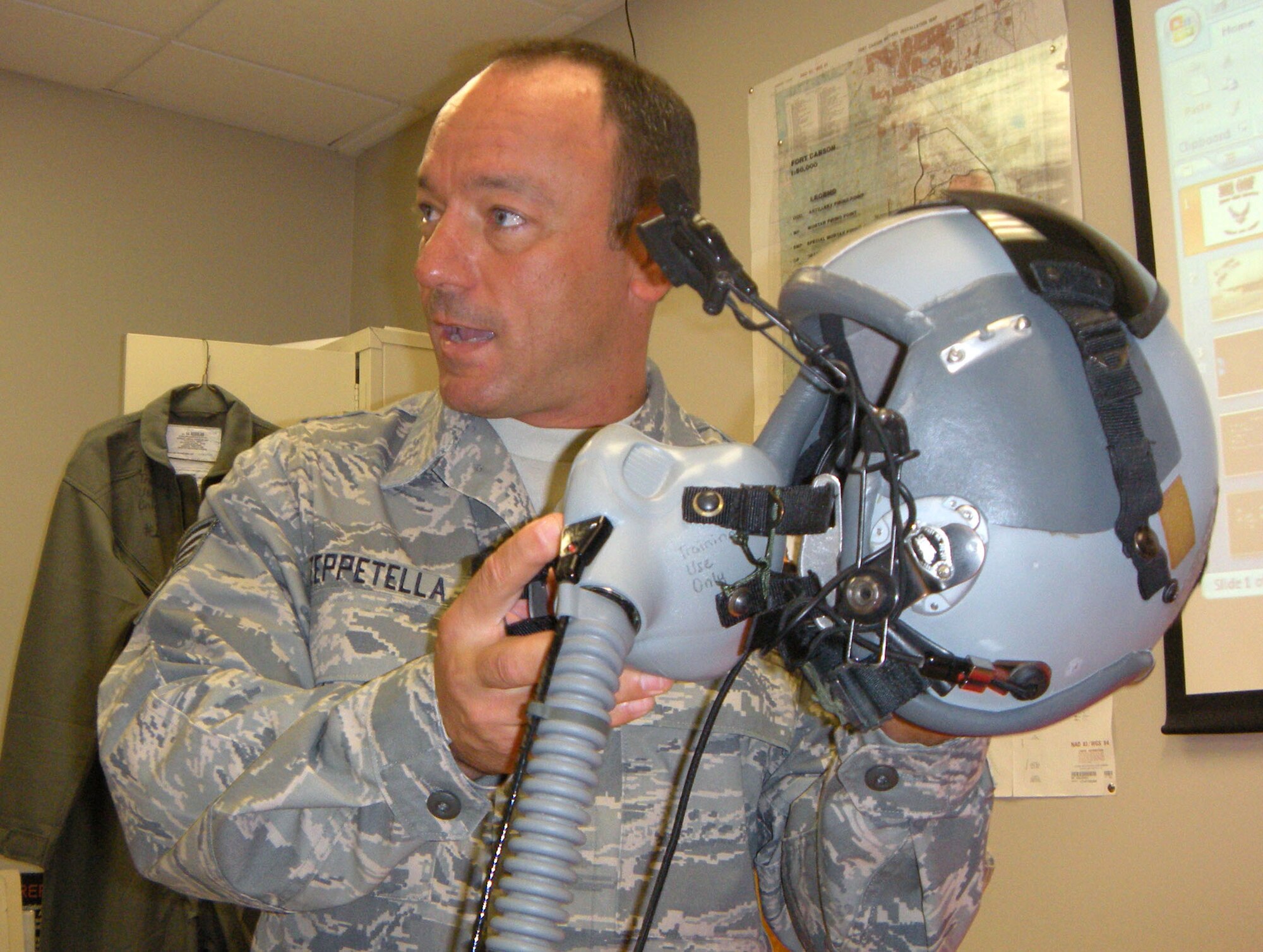Staff Sgt. Anthony Zeppetella, seen here instructing C-130 Hercules aircrew members on the use of the tactical flight helmet, was recently recognized as the 2008 Outstanding Aircrew Flight Equipment Air Reserve Component Airman of the Year. Recognized for his work while a senior airman, Sergeant Zeppetella provided 24-hour coverage for aircrews supporting the 2008 wildland aerial firefighting activities in California. He also played a key role in the 302nd Airlift Wing's Operational Readiness Inspection. Furthermore, after configuring C-130 aircraft for more than 30 Joint Airborne Air Transportability Training and Tactical Airlift Control Center missions, Sergeant Zeppetella had zero discrepancies, increasing the positive mission rate. Information made available by member's award submission. (U.S. Air Force photo/Staff Sgt. Stephen J. Collier)