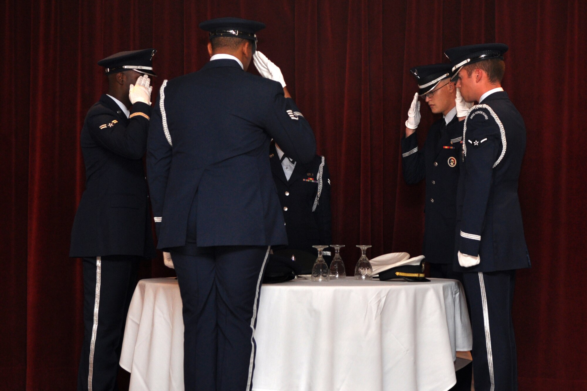 Members of the Barksdale Base Honor Guard perform the P.O.W./M.I.A. Observance ceremony during the 917th Wing, 6th Annual, Senior Noncommissioned Officer Induction and Chief’s Recognition Ceremony at the Stripes Club on Barksdale Air Force Base, La., October 3, 2009. During the ceremony, thirty-one Airmen were inducted into the Senior NCO ranks as Master Sergeants. A total of eight new Chiefs were also recognized during the evening’s events. (U.S. Air Force photo/Tech. Sgt. Jeff Walston)