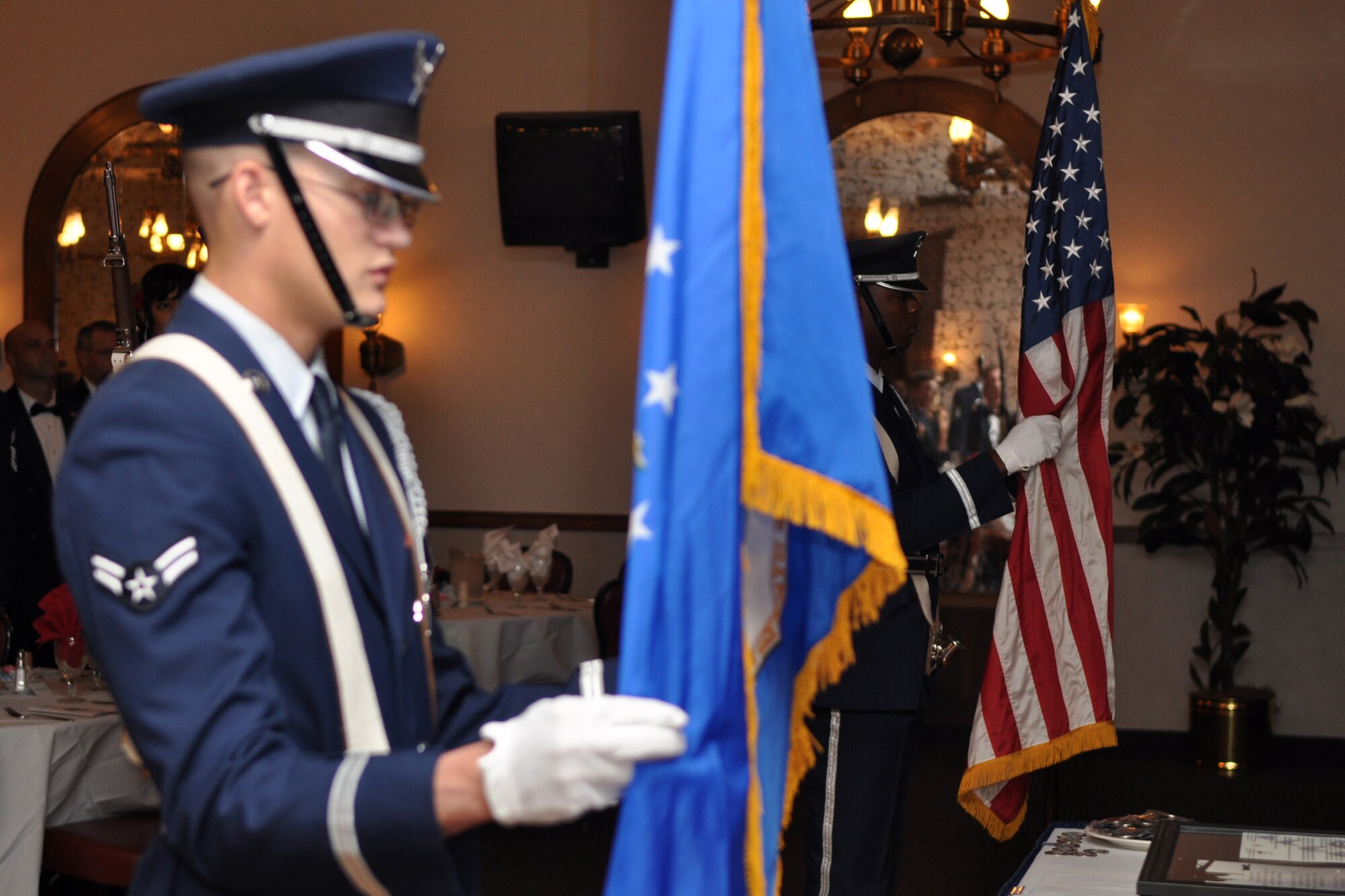 Members of the Barksdale Base Honor Guard post the colors at the 917th Wing, 6th Annual, Senior Noncommissioned Officer Induction and Chief’s Recognition Ceremony at the Stripes Club on Barksdale Air Force Base, La., October 3, 2009. During the ceremony, thirty-one Airmen were inducted into the Senior NCO ranks as Master Sergeants. A total of eight new Chiefs were also recognized during the evening’s events. (U.S. Air Force photo/Tech. Sgt. Jeff Walston)