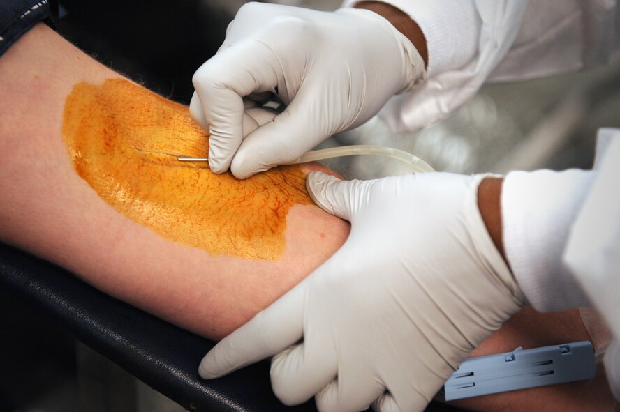 MOODY AIR FORCE BASE, Ga. -- Annie Jackson, American Red Cross collection technician II, draws blood from Jesse Webster, 23rd Civil Engineer Squadron environmental management system coordinator, during a blood drive here Oct. 2. Individuals are authorized to donate blood every 56 days as long as they meet the age requirement of being at least 17 years old and are considered to be in good health. (U.S. Air Force photo by Senior Airman Gina Chiaverotti-Paige)