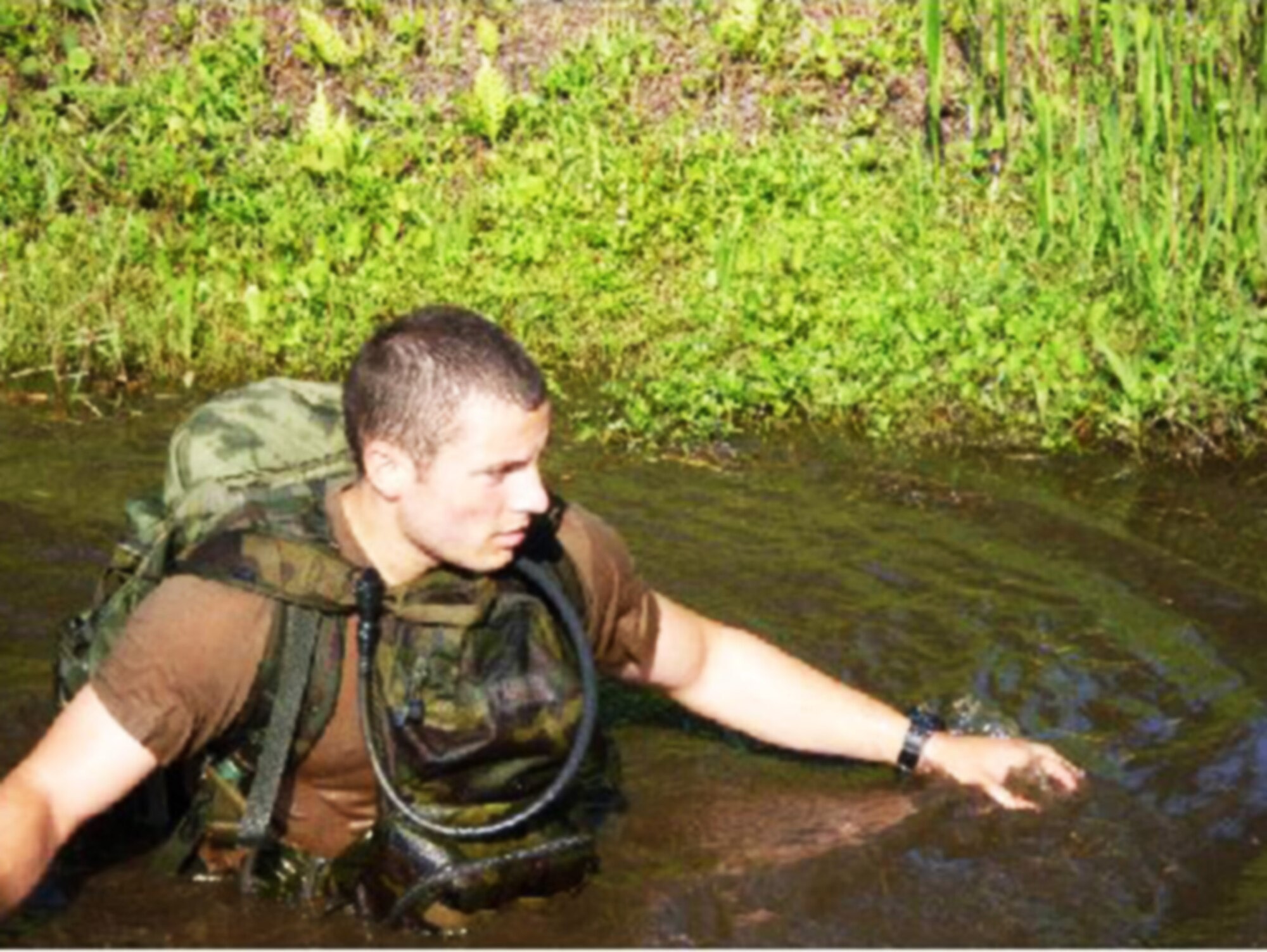 Norwich University ROTC Cadet Ian Kemp walks through the marsh as part of the special operations orientation professional development training Sept. 23, 2009, at Hurlburt Field, Fla. Cadet Kemp is assigned to Air Force ROTC Det. 867. (U.S. Air Force photo/Maj. Jeff Cooper) 