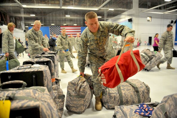 SHAW AIR FORCE BASE, S.C. -- Airmen of the 20th Fighter Wing stack their bags before departing on a four-month deployment to Afghanistan, Oct. 5. (U.S. Air Force photo/Senior Airman Kathrine McDowell)