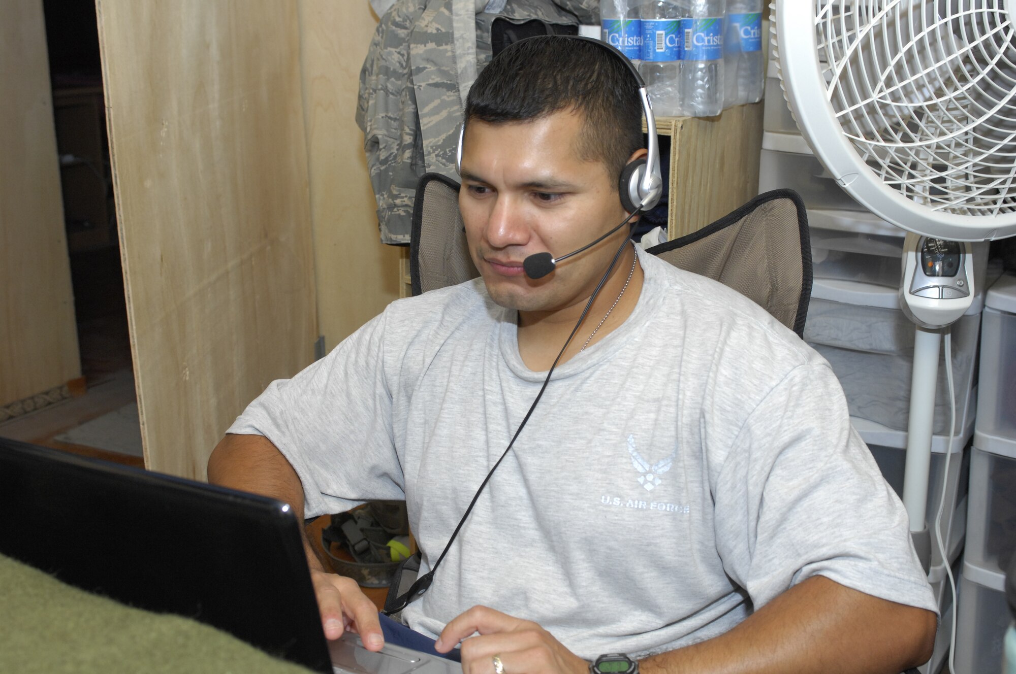 Staff Sgt. Juan Gutierrez, 12th Dental Squadron, uses his computer to conduct a video chat with his children while deployed. Sergeant Gutierrez is currently serving as the Dental Clinic NCOIC for Task Force Medical at Bagram Airfield, Afghanistan. (U.S. Air Force photo/Tech. Sgt. John Jung)